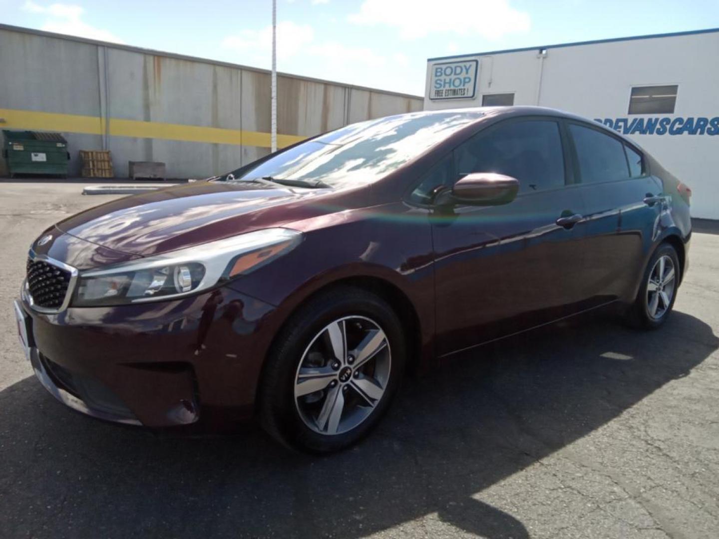 2018 Garnet Red /Black Kia Forte LX 6M (3KPFL4A79JE) with an 2.0L L4 DOHC 16V engine, 6M transmission, located at 6064 Gull Rd, Kalamazoo, MI, 49048, (269) 222-0088, 42.328388, -85.512924 - <b>Equipment</b><br>The vehicle offers Android Auto for seamless smartphone integration. Bluetooth technology is built into the vehicle, keeping your hands on the steering wheel and your focus on the road. See what's behind you with the back up camera on this Kia Forte. The Kia Forte offers Apple Ca - Photo#4