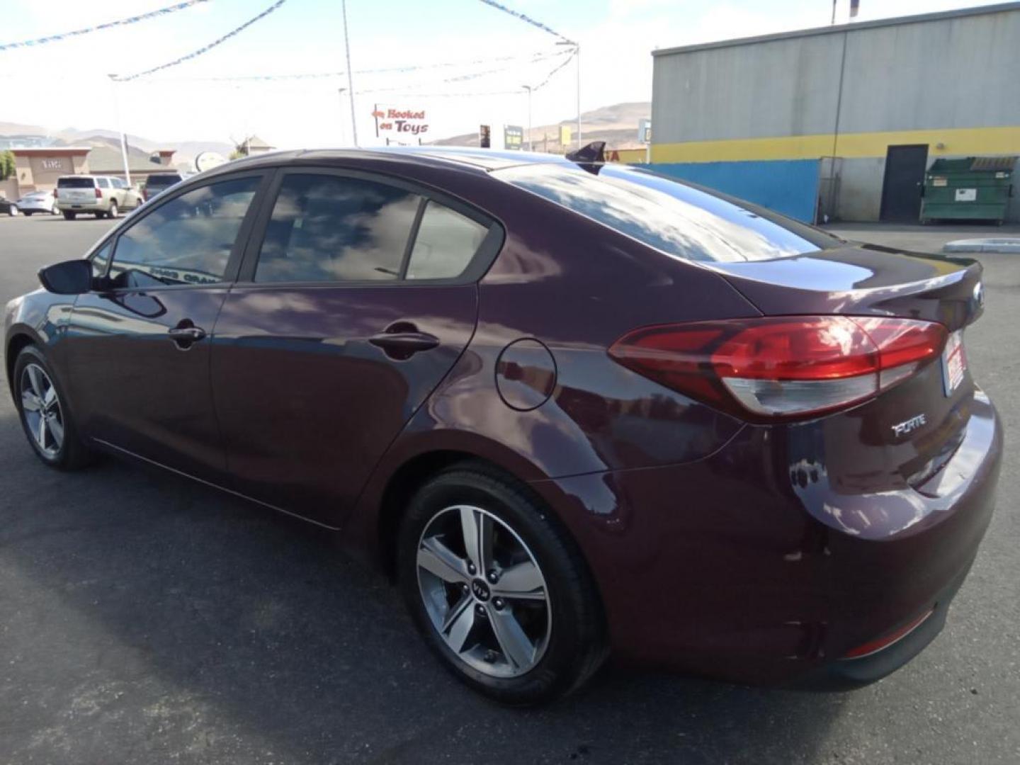 2018 Garnet Red /Black Kia Forte LX 6M (3KPFL4A79JE) with an 2.0L L4 DOHC 16V engine, 6M transmission, located at 6064 Gull Rd, Kalamazoo, MI, 49048, (269) 222-0088, 42.328388, -85.512924 - <b>Equipment</b><br>The vehicle offers Android Auto for seamless smartphone integration. Bluetooth technology is built into the vehicle, keeping your hands on the steering wheel and your focus on the road. See what's behind you with the back up camera on this Kia Forte. The Kia Forte offers Apple Ca - Photo#5