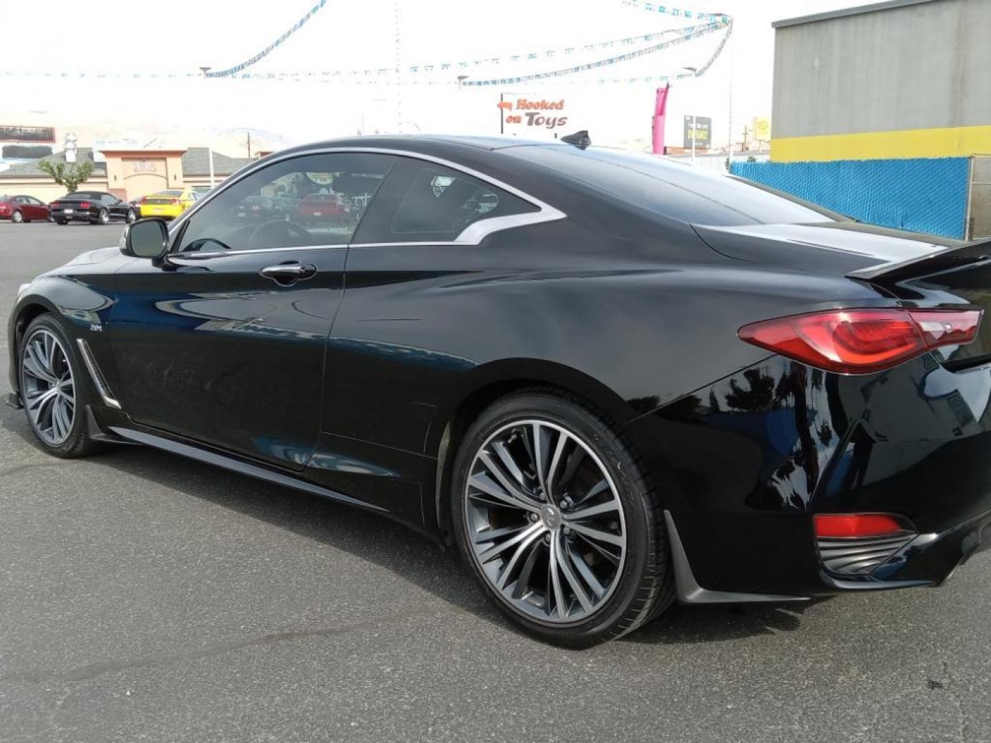 2017 Black Obsidian /Graphite Infiniti Q60 2.0t AWD (JN1CV7EL5HM) with an 2.0L L4 DOHC 16V TURBO engine, 7A transmission, located at 6064 Gull Rd, Kalamazoo, MI, 49048, (269) 222-0088, 42.328388, -85.512924 - <b>Equipment</b><br>The INFINITI Q60 features a hands-free Bluetooth phone system. The leather seats in this model are a must for buyers looking for comfort, durability, and style. This mid-size car is equipped with the latest generation of XM/Sirius Radio. The vehicle offers Automatic Climate Contr - Photo#7