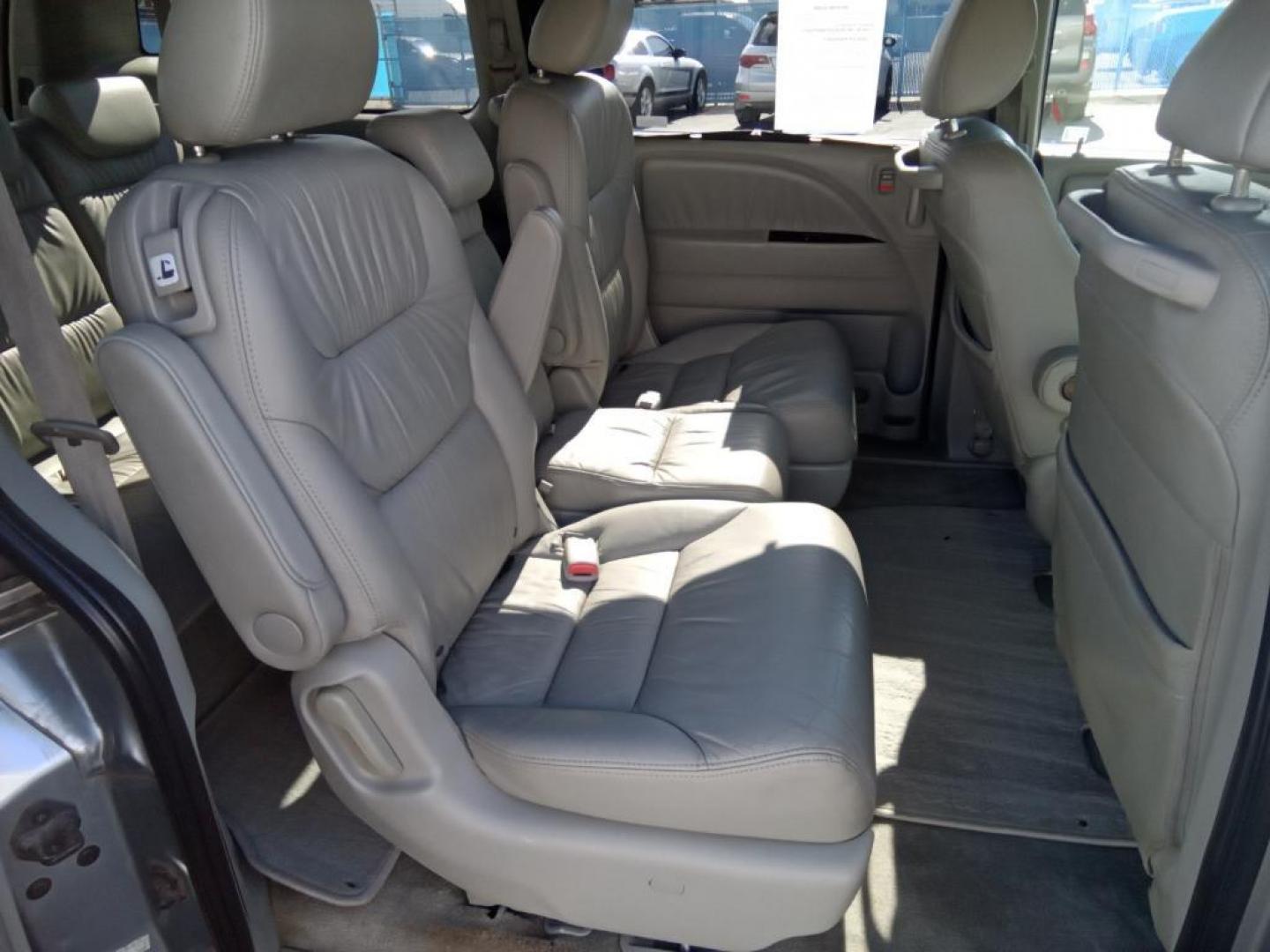 2009 Silver Pearl Metallic /Gray Honda Odyssey EX-L w/ DVD (5FNRL387X9B) with an 3.5L V6 SOHC 24V engine, 5-Speed Automatic transmission, located at 6064 Gull Rd, Kalamazoo, MI, 49048, (269) 222-0088, 42.328388, -85.512924 - The installed navigation system will keep you on the right path. It keeps you comfortable with Auto Climate. The leather seats in the vehicle are a must for buyers looking for comfort, durability, and style. See what's behind you with the back up camera on the Honda Odyssey. The vehicle is front whe - Photo#22