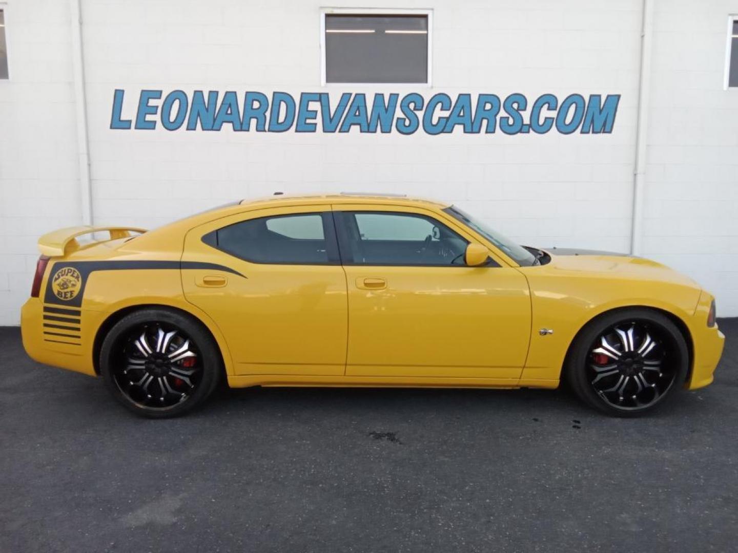 2007 GOLD Dodge Charger SRT8 (2B3LA73W27H) with an 6.1L V8 OHV 16V engine, 5-Speed Automatic Overdrive transmission, located at 6064 Gull Rd, Kalamazoo, MI, 49048, (269) 222-0088, 42.328388, -85.512924 - The leather seats in this model are a must for buyers looking for comfort, durability, and style. The vehicle is rear wheel drive. This vehicle projects regal stylish lines refined with a royal gold finish. The gas and brake pedals adjust allowing you to fine-tune them for personal fit and comfort. - Photo#0