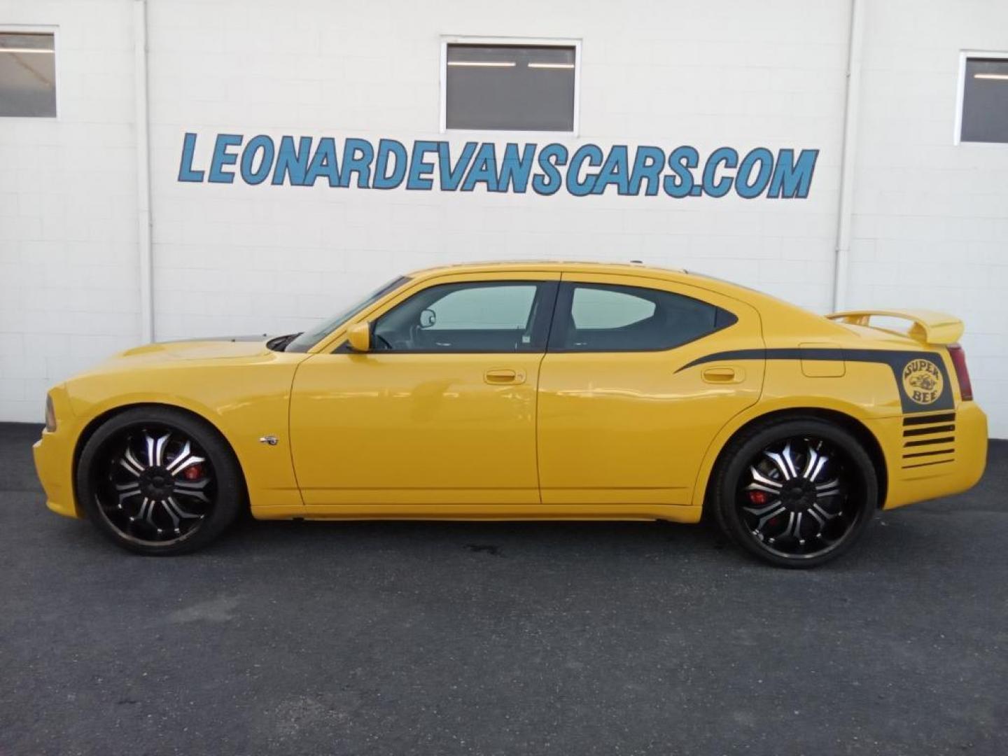 2007 GOLD Dodge Charger SRT8 (2B3LA73W27H) with an 6.1L V8 OHV 16V engine, 5-Speed Automatic Overdrive transmission, located at 6064 Gull Rd, Kalamazoo, MI, 49048, (269) 222-0088, 42.328388, -85.512924 - The leather seats in this model are a must for buyers looking for comfort, durability, and style. The vehicle is rear wheel drive. This vehicle projects regal stylish lines refined with a royal gold finish. The gas and brake pedals adjust allowing you to fine-tune them for personal fit and comfort. - Photo#1