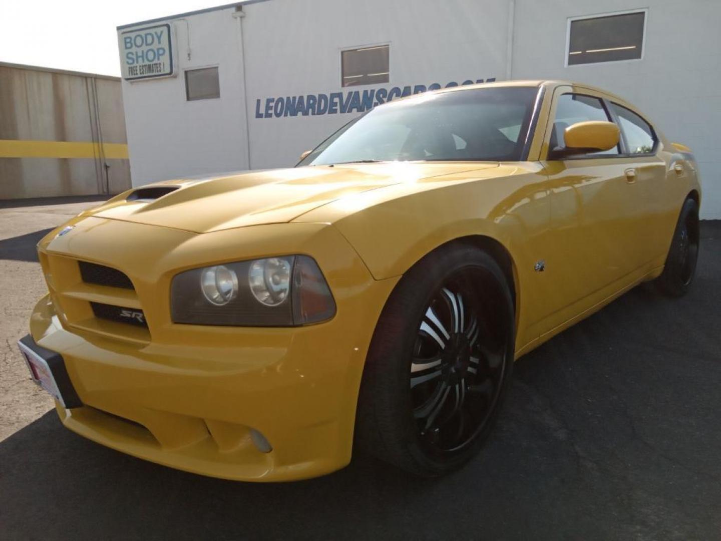 2007 GOLD Dodge Charger SRT8 (2B3LA73W27H) with an 6.1L V8 OHV 16V engine, 5-Speed Automatic Overdrive transmission, located at 6064 Gull Rd, Kalamazoo, MI, 49048, (269) 222-0088, 42.328388, -85.512924 - The leather seats in this model are a must for buyers looking for comfort, durability, and style. The vehicle is rear wheel drive. This vehicle projects regal stylish lines refined with a royal gold finish. The gas and brake pedals adjust allowing you to fine-tune them for personal fit and comfort. - Photo#2