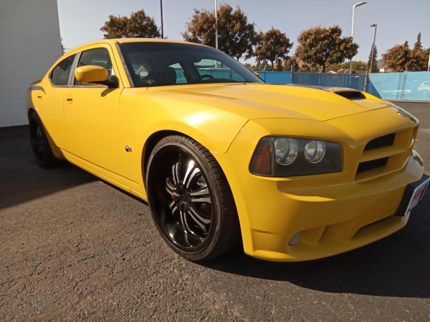 2007 GOLD Dodge Charger SRT8 (2B3LA73W27H) with an 6.1L V8 OHV 16V engine, 5-Speed Automatic Overdrive transmission, located at 6064 Gull Rd, Kalamazoo, MI, 49048, (269) 222-0088, 42.328388, -85.512924 - The leather seats in this model are a must for buyers looking for comfort, durability, and style. The vehicle is rear wheel drive. This vehicle projects regal stylish lines refined with a royal gold finish. The gas and brake pedals adjust allowing you to fine-tune them for personal fit and comfort. - Photo#5