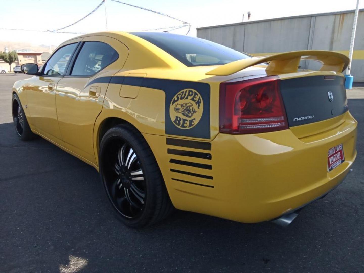 2007 GOLD Dodge Charger SRT8 (2B3LA73W27H) with an 6.1L V8 OHV 16V engine, 5-Speed Automatic Overdrive transmission, located at 6064 Gull Rd, Kalamazoo, MI, 49048, (269) 222-0088, 42.328388, -85.512924 - The leather seats in this model are a must for buyers looking for comfort, durability, and style. The vehicle is rear wheel drive. This vehicle projects regal stylish lines refined with a royal gold finish. The gas and brake pedals adjust allowing you to fine-tune them for personal fit and comfort. - Photo#8