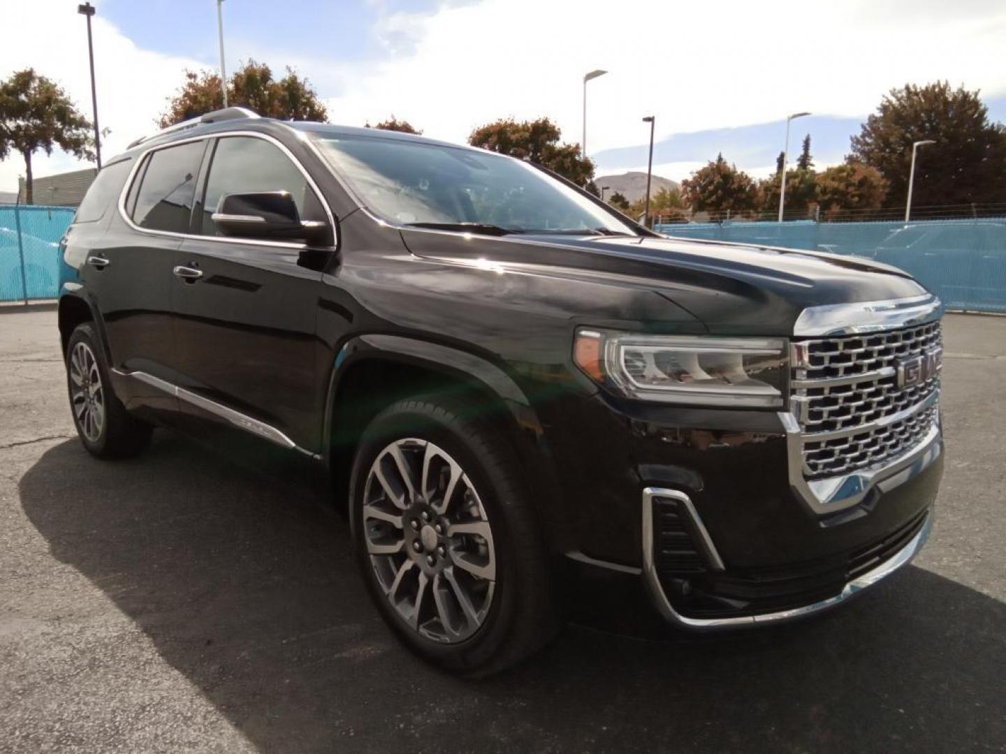 2021 Ebony Twilight Metallic GMC Acadia Denali AWD (1GKKNXLS9MZ) with an 3.6L V6 DOHC 24V engine, 6A transmission, located at 6064 Gull Rd, Kalamazoo, MI, 49048, (269) 222-0088, 42.328388, -85.512924 - The leather seats in it are a must for buyers looking for comfort, durability, and style. This vehicle offers Apple CarPlay for seamless connectivity. This mid-size suv's Lane Departure Warning keeps you safe by alerting you when you drift from your lane. Engulf yourself with the crystal clear sound - Photo#4