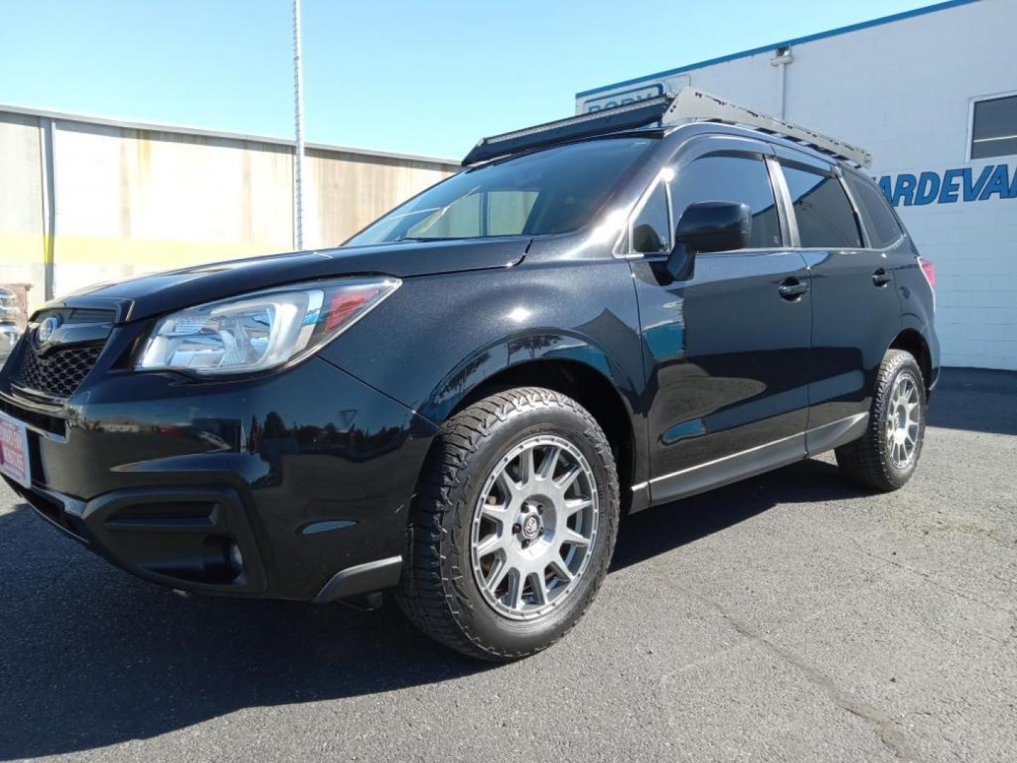 2017 Crystal Black Silica /Black Subaru Forester 2.5i Premium PZEV CVT (JF2SJABC9HH) with an 2.5L H4 SOHC 16V engine, CVT transmission, located at 6064 Gull Rd, Kalamazoo, MI, 49048, (269) 222-0088, 42.328388, -85.512924 - <b>Equipment</b><br>Bluetooth technology is built into this model, keeping your hands on the steering wheel and your focus on the road. See what's behind you with the back up camera on this Subaru Forester. Conquer any rainy, snowy, or icy road conditions this winter with the all wheel drive system - Photo#2