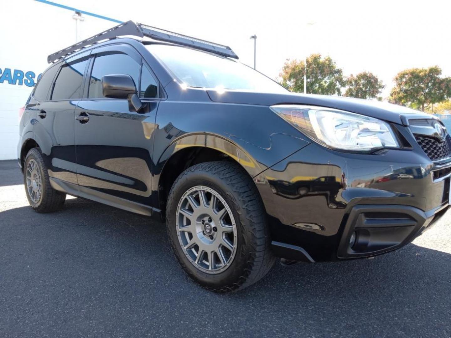 2017 Crystal Black Silica /Black Subaru Forester 2.5i Premium PZEV CVT (JF2SJABC9HH) with an 2.5L H4 SOHC 16V engine, CVT transmission, located at 6064 Gull Rd, Kalamazoo, MI, 49048, (269) 222-0088, 42.328388, -85.512924 - <b>Equipment</b><br>Bluetooth technology is built into this model, keeping your hands on the steering wheel and your focus on the road. See what's behind you with the back up camera on this Subaru Forester. Conquer any rainy, snowy, or icy road conditions this winter with the all wheel drive system - Photo#4