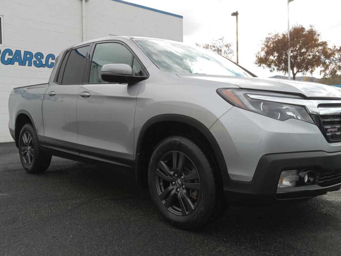 2019 Lunar Silver Metallic /Black Honda Ridgeline Sport AWD (5FPYK3F18KB) with an 3.5L V6 SOHC 24V engine, 6A transmission, located at 6064 Gull Rd, Kalamazoo, MI, 49048, (269) 222-0088, 42.328388, -85.512924 - This model keeps you comfortable with Auto Climate. Protect the Honda Ridgeline from unwanted accidents with a cutting edge backup camera system. It's AutoCheck: 1 owner, assurance of single-owner history for peace of mind. Bluetooth technology is built into it, keeping your hands on the steering wh - Photo#4