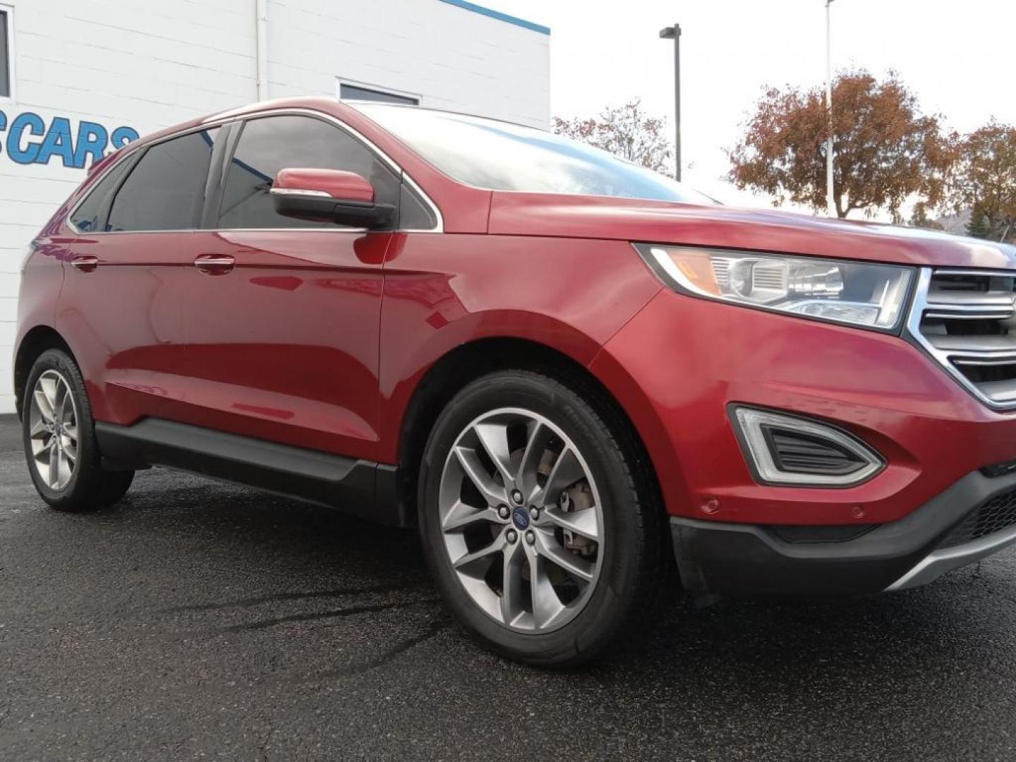 2015 Ruby Red Metallic Tinted Clearcoat Ford Edge Titanium AWD (2FMPK4K87FB) with an 3.5L V6 DOHC 24V engine, 6-Speed Automatic transmission, located at 6064 Gull Rd, Kalamazoo, MI, 49048, (269) 222-0088, 42.328388, -85.512924 - <b>Equipment</b><br>It offers Automatic Climate Control for personalized comfort. This 2015 Ford Edge is pure luxury with a heated steering wheel. Bluetooth technology is built into this model, keeping your hands on the steering wheel and your focus on the road. The leather seats in this vehicle ar - Photo#4