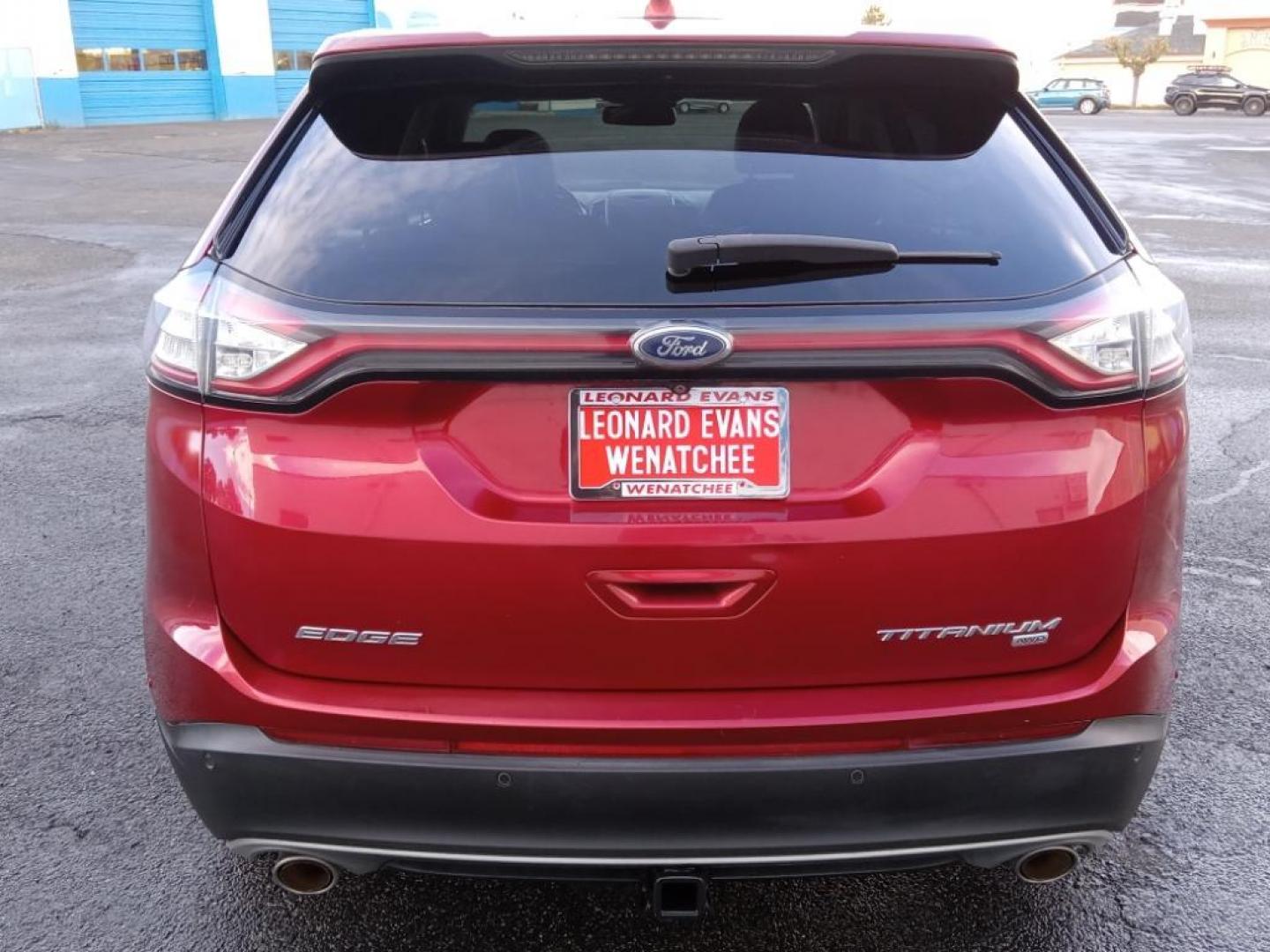 2015 Ruby Red Metallic Tinted Clearcoat Ford Edge Titanium AWD (2FMPK4K87FB) with an 3.5L V6 DOHC 24V engine, 6-Speed Automatic transmission, located at 6064 Gull Rd, Kalamazoo, MI, 49048, (269) 222-0088, 42.328388, -85.512924 - <b>Equipment</b><br>It offers Automatic Climate Control for personalized comfort. This 2015 Ford Edge is pure luxury with a heated steering wheel. Bluetooth technology is built into this model, keeping your hands on the steering wheel and your focus on the road. The leather seats in this vehicle ar - Photo#6