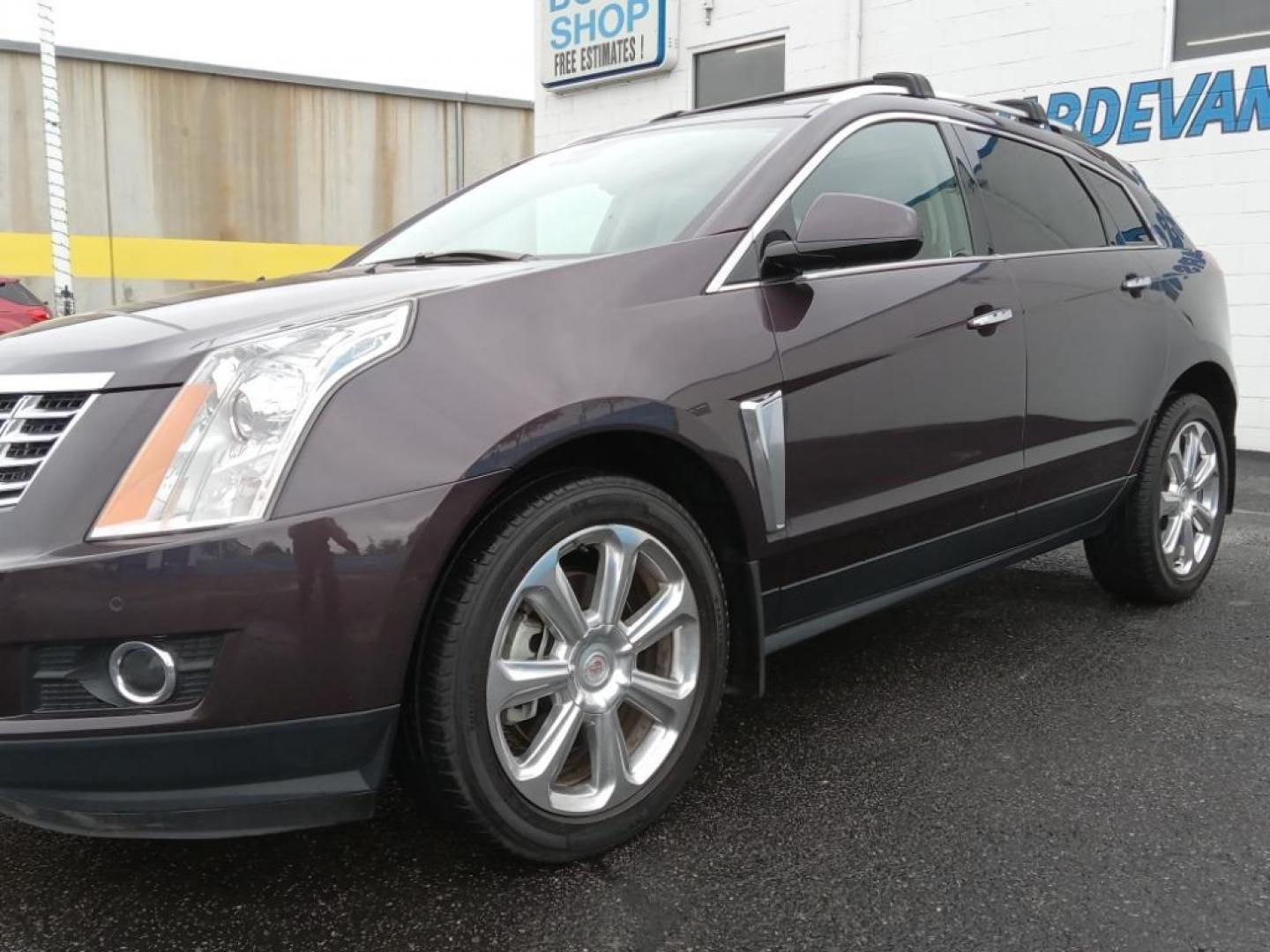 2015 Majestic Plum Metallic /Ebony/Ebony Accents Cadillac SRX Performance Collection AWD (3GYFNFE32FS) with an 3.6L V6 DOHC 24V FFV engine, 6-Speed Automatic transmission, located at 6064 Gull Rd, Kalamazoo, MI, 49048, (269) 222-0088, 42.328388, -85.512924 - <b>Equipment</b><br>It's AutoCheck: 1 owner, assurance of single-owner history for peace of mind. This mid-size suv has a clean AutoCheck report, ensuring its impeccable vehicle history. Night driving with HID Xenon headlamps is a breeze in this vehicle. Never get into a cold vehicle again with the - Photo#2