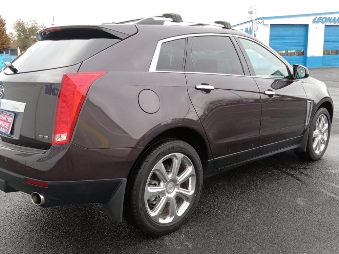 2015 Majestic Plum Metallic /Ebony/Ebony Accents Cadillac SRX Performance Collection AWD (3GYFNFE32FS) with an 3.6L V6 DOHC 24V FFV engine, 6-Speed Automatic transmission, located at 6064 Gull Rd, Kalamazoo, MI, 49048, (269) 222-0088, 42.328388, -85.512924 - <b>Equipment</b><br>It's AutoCheck: 1 owner, assurance of single-owner history for peace of mind. This mid-size suv has a clean AutoCheck report, ensuring its impeccable vehicle history. Night driving with HID Xenon headlamps is a breeze in this vehicle. Never get into a cold vehicle again with the - Photo#5