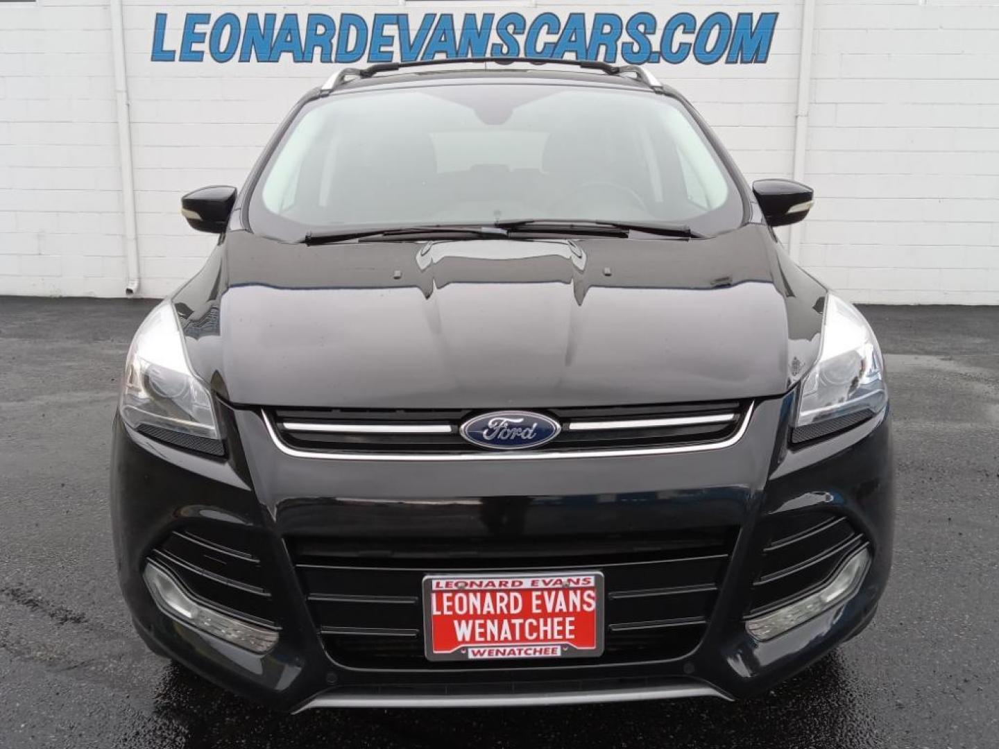 2015 BLACK /Charcoal Black Ford Escape Titanium 4WD (1FMCU9J93FU) with an 2.0L L4 DOHC 16V engine, 6-Speed Automatic transmission, located at 6064 Gull Rd, Kalamazoo, MI, 49048, (269) 222-0088, 42.328388, -85.512924 - <b>Equipment</b><br>The leather seats in the vehicle are a must for buyers looking for comfort, durability, and style. The vehicle keeps you comfortable with Auto Climate. See what's behind you with the back up camera on it. The Ford Escape will allow to see the road and so much more with the HID he - Photo#3