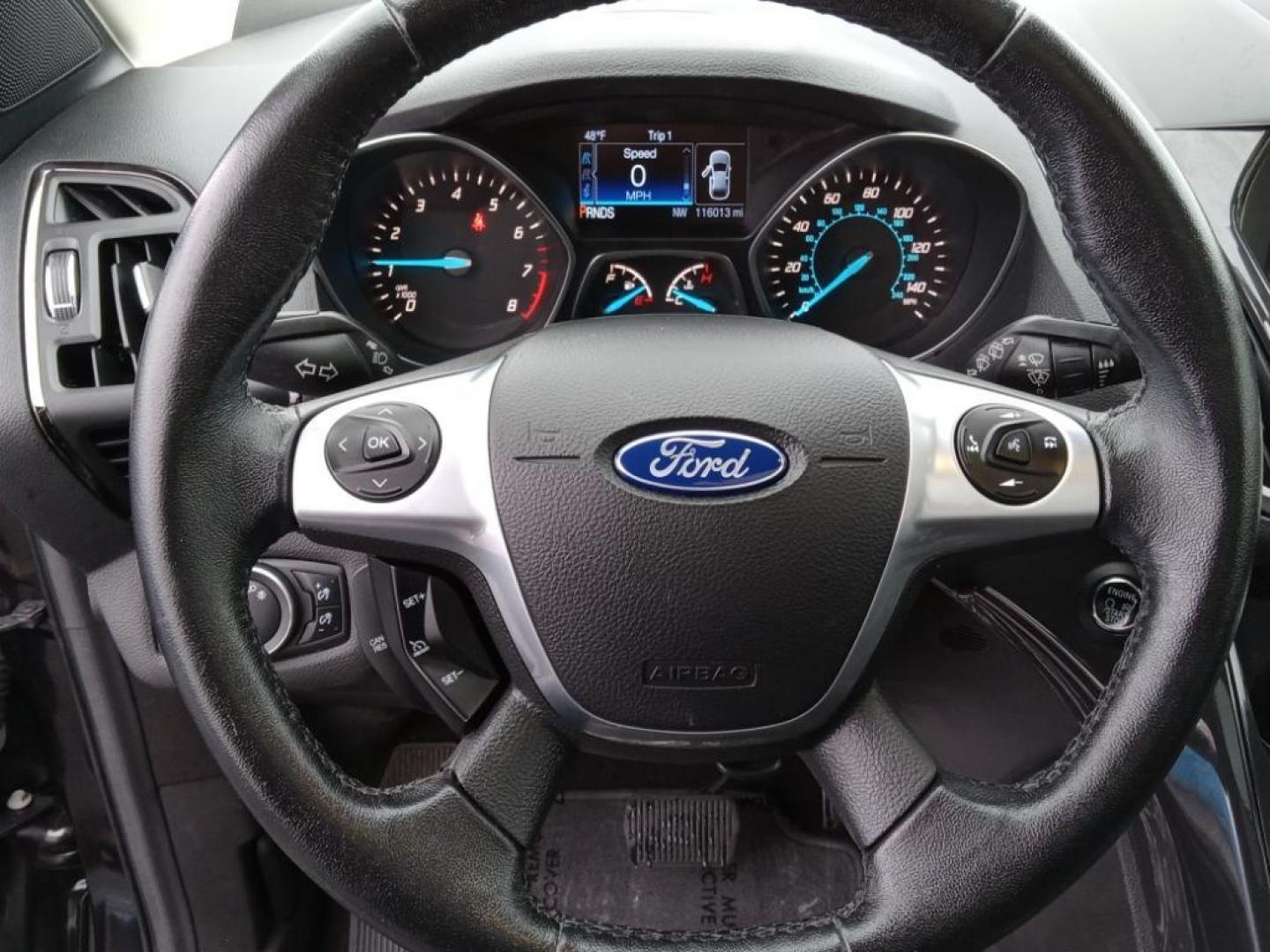 2015 BLACK /Charcoal Black Ford Escape Titanium 4WD (1FMCU9J93FU) with an 2.0L L4 DOHC 16V engine, 6-Speed Automatic transmission, located at 6064 Gull Rd, Kalamazoo, MI, 49048, (269) 222-0088, 42.328388, -85.512924 - <b>Equipment</b><br>The leather seats in the vehicle are a must for buyers looking for comfort, durability, and style. The vehicle keeps you comfortable with Auto Climate. See what's behind you with the back up camera on it. The Ford Escape will allow to see the road and so much more with the HID he - Photo#10