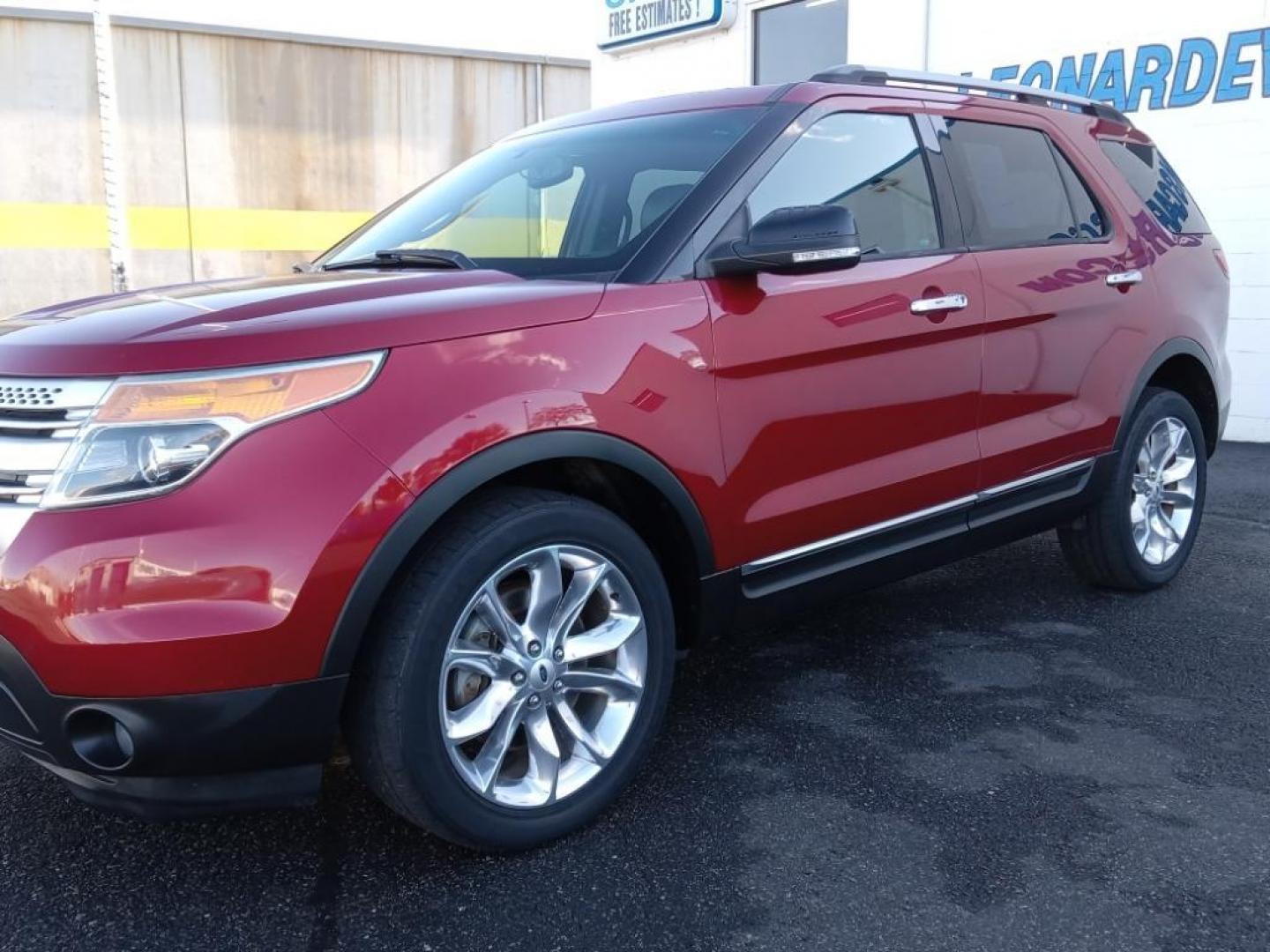 2014 Ruby Red Metallic Tinted Clearcoat /Medium Light Stone Ford Explorer XLT 4WD (1FM5K8D88EG) with an 3.5L V6 DOHC 24V engine, 6-Speed Automatic transmission, located at 6064 Gull Rd, Kalamazoo, MI, 49048, (269) 222-0088, 42.328388, -85.512924 - <b>Equipment</b><br>The leather seats in this 1/2 ton suv are a must for buyers looking for comfort, durability, and style. Bluetooth technology is built into this vehicle, keeping your hands on the steering wheel and your focus on the road. The installed navigation system will keep you on the right - Photo#2