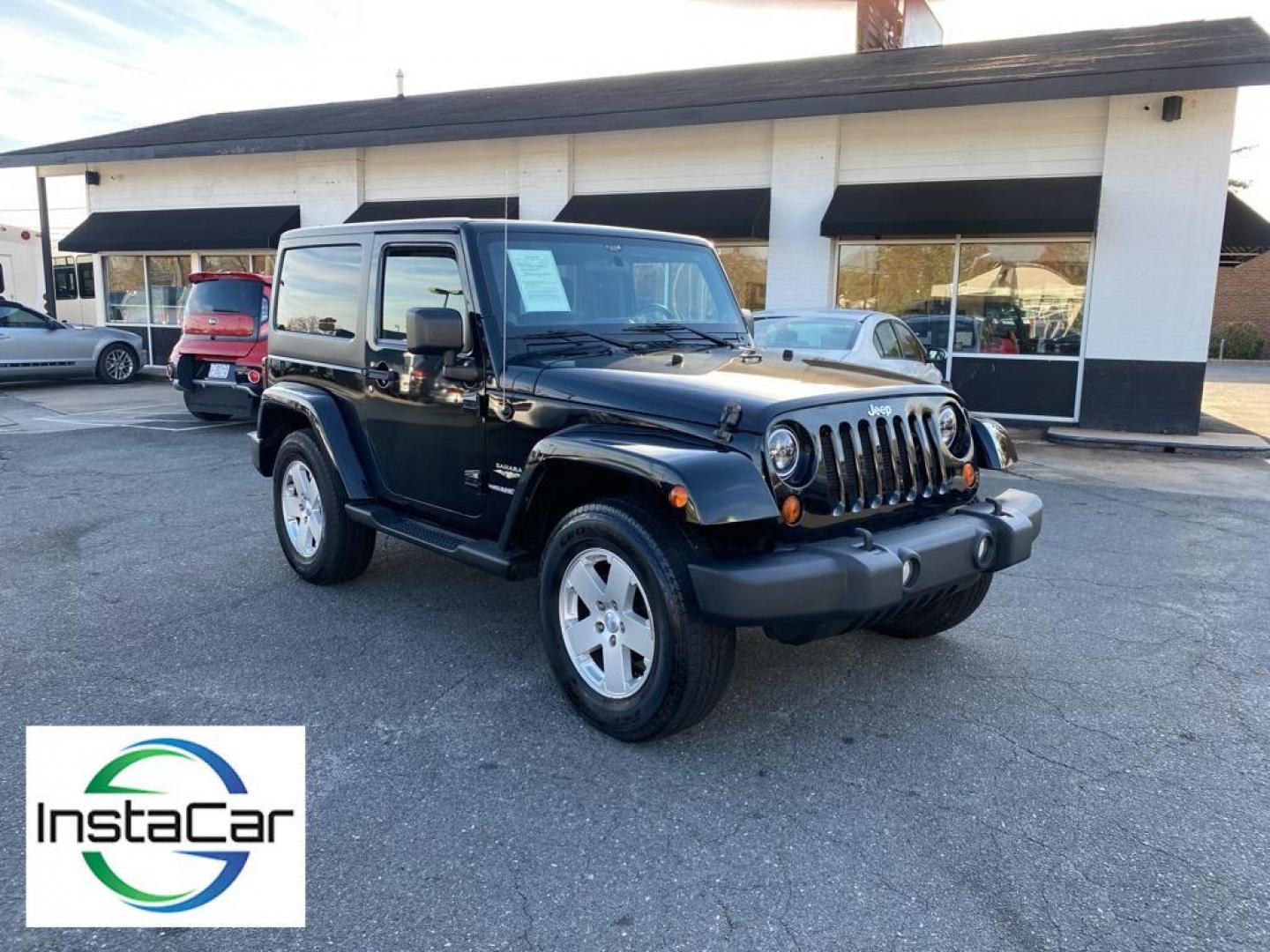 2012 Black Forest Green Pearlcoat /Black Jeep Wrangler Sahara 4WD (1C4AJWBG5CL) with an 3.6L V6 DOHC 24V FFV engine, 5-speed automatic transmission, located at 6064 Gull Rd, Kalamazoo, MI, 49048, (269) 222-0088, 42.328388, -85.512924 - Discover the rugged sophistication of the 2012 Jeep Wrangler Sahara, a versatile SUV that seamlessly blends off-road capability with modern comfort. This pre-owned gem, featuring a robust V6, 3.6L engine, delivers impressive power and performance, making it the perfect companion for both urban commu - Photo#7