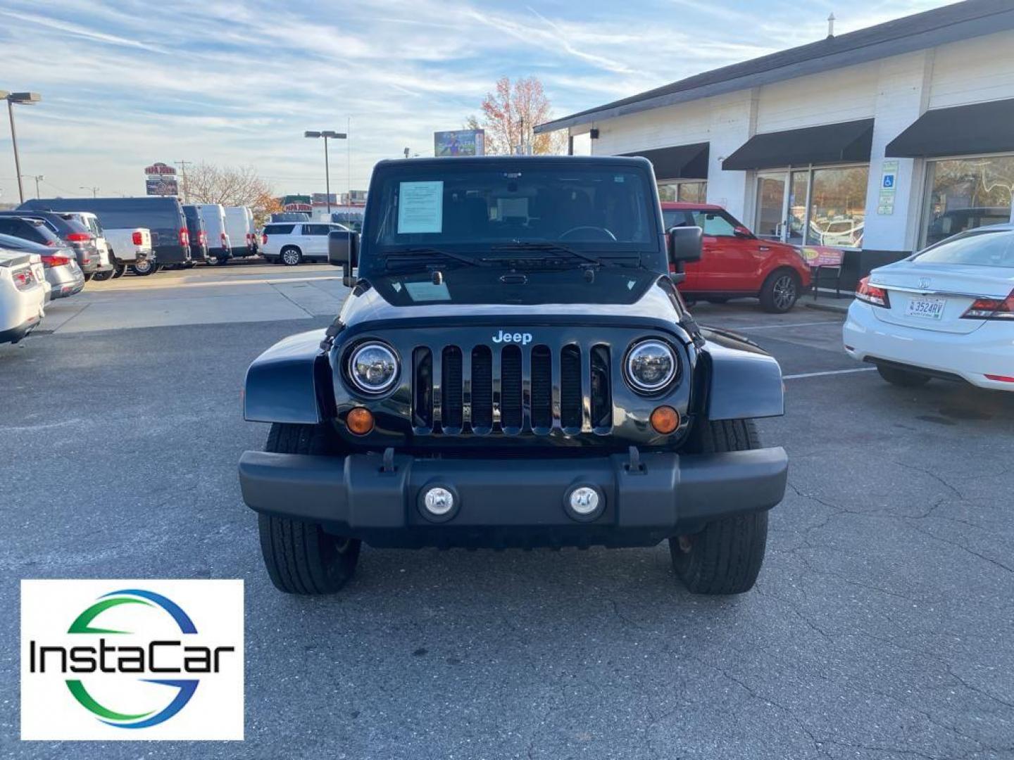 2012 Black Forest Green Pearlcoat /Black Jeep Wrangler Sahara 4WD (1C4AJWBG5CL) with an 3.6L V6 DOHC 24V FFV engine, 5-speed automatic transmission, located at 6064 Gull Rd, Kalamazoo, MI, 49048, (269) 222-0088, 42.328388, -85.512924 - Discover the rugged sophistication of the 2012 Jeep Wrangler Sahara, a versatile SUV that seamlessly blends off-road capability with modern comfort. This pre-owned gem, featuring a robust V6, 3.6L engine, delivers impressive power and performance, making it the perfect companion for both urban commu - Photo#8