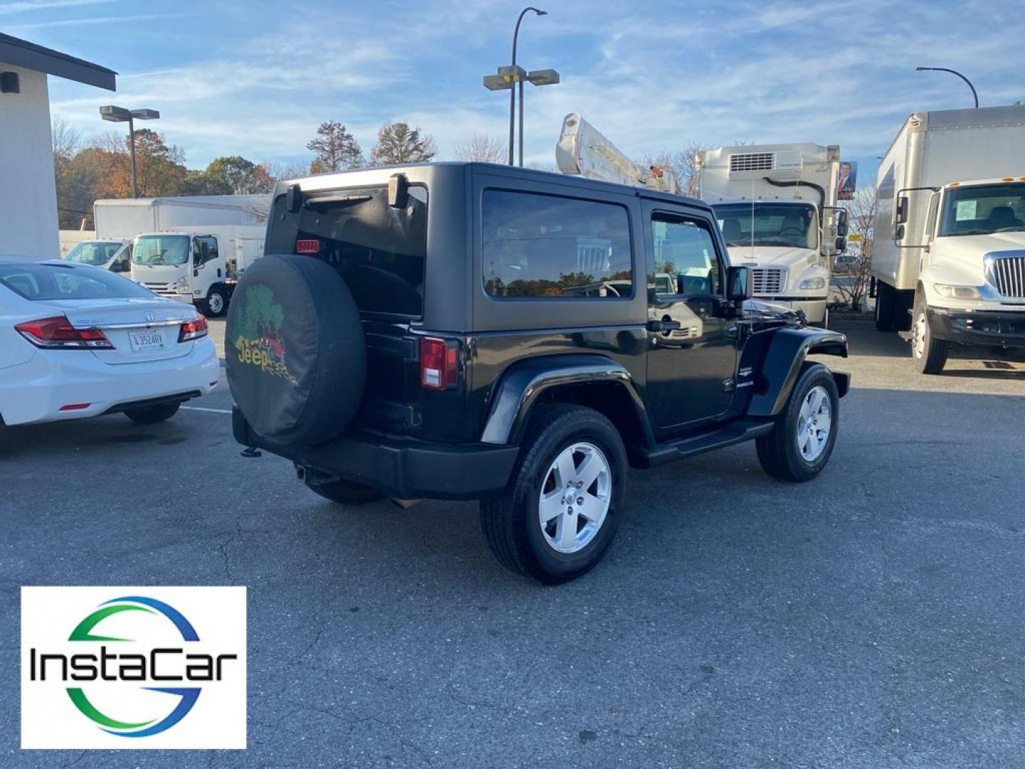 2012 Black Forest Green Pearlcoat /Black Jeep Wrangler Sahara 4WD (1C4AJWBG5CL) with an 3.6L V6 DOHC 24V FFV engine, 5-speed automatic transmission, located at 6064 Gull Rd, Kalamazoo, MI, 49048, (269) 222-0088, 42.328388, -85.512924 - Discover the rugged sophistication of the 2012 Jeep Wrangler Sahara, a versatile SUV that seamlessly blends off-road capability with modern comfort. This pre-owned gem, featuring a robust V6, 3.6L engine, delivers impressive power and performance, making it the perfect companion for both urban commu - Photo#13