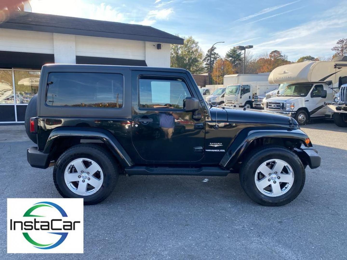 2012 Black Forest Green Pearlcoat /Black Jeep Wrangler Sahara 4WD (1C4AJWBG5CL) with an 3.6L V6 DOHC 24V FFV engine, 5-speed automatic transmission, located at 6064 Gull Rd, Kalamazoo, MI, 49048, (269) 222-0088, 42.328388, -85.512924 - Discover the rugged sophistication of the 2012 Jeep Wrangler Sahara, a versatile SUV that seamlessly blends off-road capability with modern comfort. This pre-owned gem, featuring a robust V6, 3.6L engine, delivers impressive power and performance, making it the perfect companion for both urban commu - Photo#14