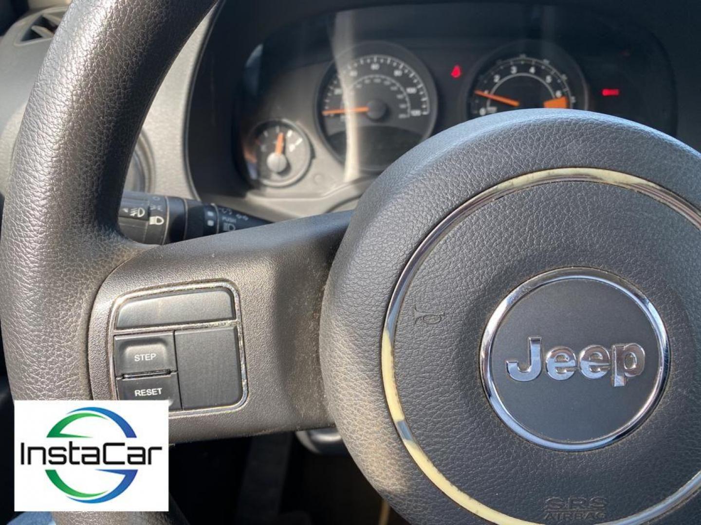 2014 Black Clearcoat /Dark Slate Gray Jeep Compass Sport FWD (1C4NJCBA9ED) with an 2.0L L4 DOHC 16V engine, 5-speed manual transmission, located at 6064 Gull Rd, Kalamazoo, MI, 49048, (269) 222-0088, 42.328388, -85.512924 - Introducing the impeccable 2014 Jeep Compass Sport, now available at our esteemed dealership. This used gem has been meticulously maintained and is ready to embark on its next adventure with you. With a remarkable mileage of 179,461 miles, this SUV has proven its reliability and longevity, making it - Photo#4