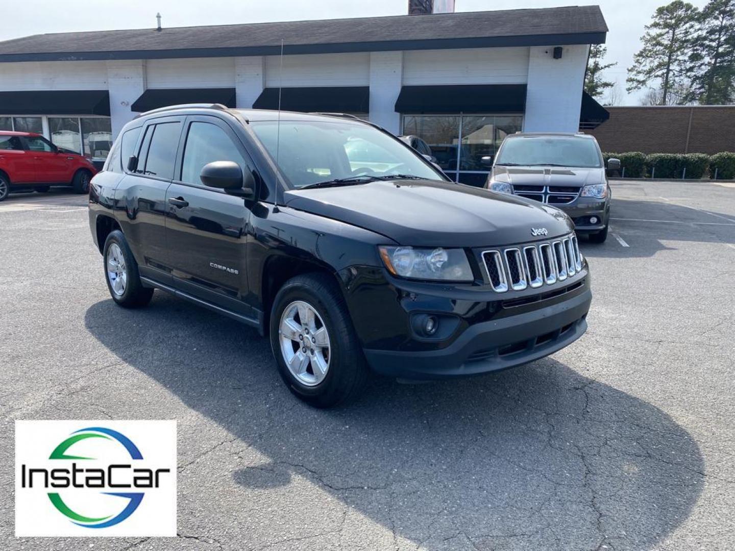 2014 Black Clearcoat /Dark Slate Gray Jeep Compass Sport FWD (1C4NJCBA9ED) with an 2.0L L4 DOHC 16V engine, 5-speed manual transmission, located at 6064 Gull Rd, Kalamazoo, MI, 49048, (269) 222-0088, 42.328388, -85.512924 - Introducing the impeccable 2014 Jeep Compass Sport, now available at our esteemed dealership. This used gem has been meticulously maintained and is ready to embark on its next adventure with you. With a remarkable mileage of 179,461 miles, this SUV has proven its reliability and longevity, making it - Photo#7