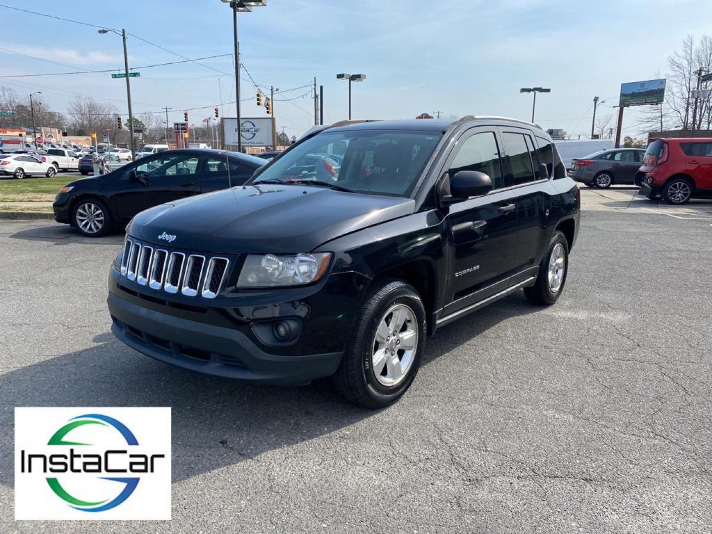 2014 Black Clearcoat /Dark Slate Gray Jeep Compass Sport FWD (1C4NJCBA9ED) with an 2.0L L4 DOHC 16V engine, 5-speed manual transmission, located at 6064 Gull Rd, Kalamazoo, MI, 49048, (269) 222-0088, 42.328388, -85.512924 - Introducing the impeccable 2014 Jeep Compass Sport, now available at our esteemed dealership. This used gem has been meticulously maintained and is ready to embark on its next adventure with you. With a remarkable mileage of 179,461 miles, this SUV has proven its reliability and longevity, making it - Photo#9