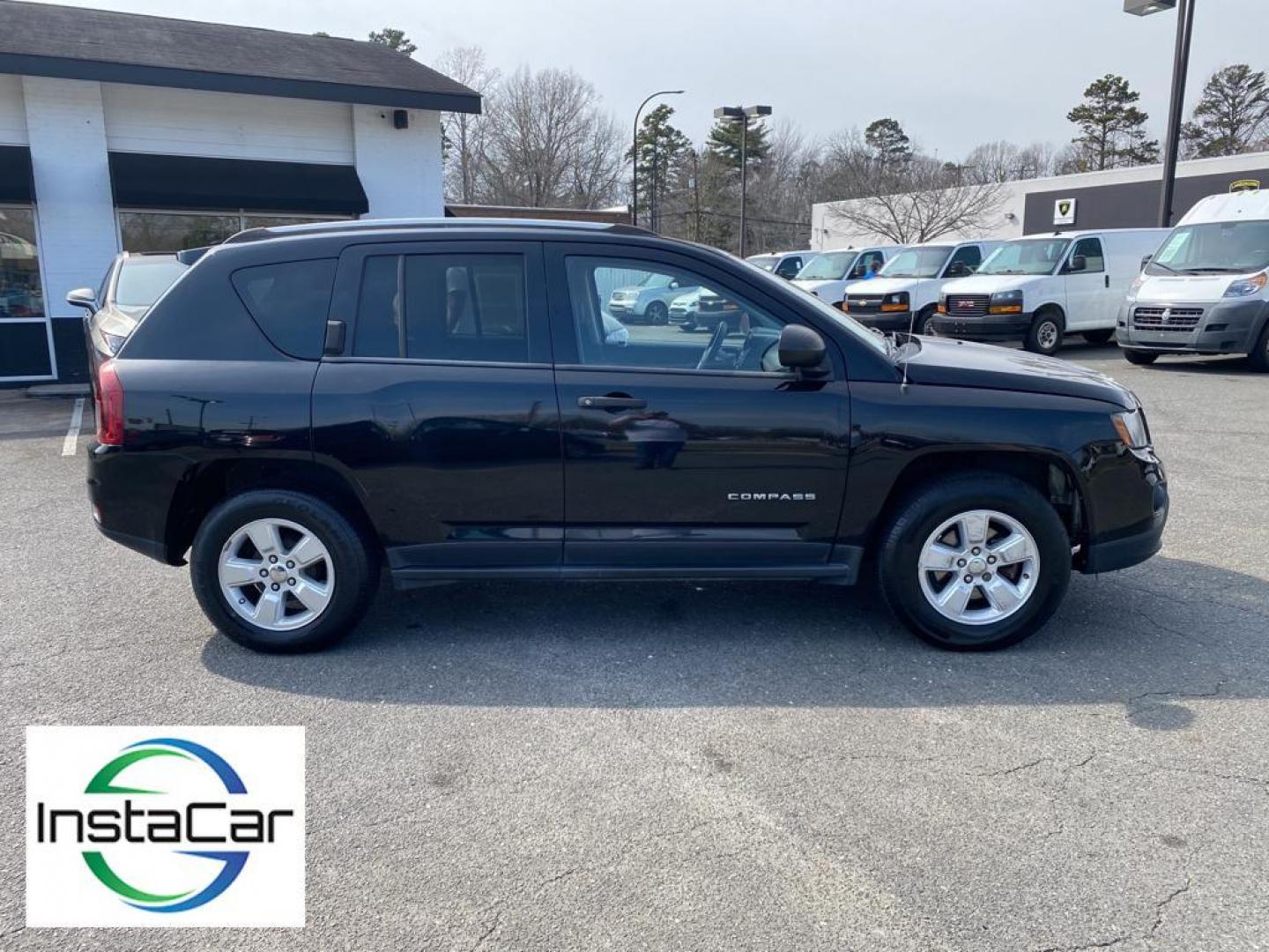 2014 Black Clearcoat /Dark Slate Gray Jeep Compass Sport FWD (1C4NJCBA9ED) with an 2.0L L4 DOHC 16V engine, 5-speed manual transmission, located at 6064 Gull Rd, Kalamazoo, MI, 49048, (269) 222-0088, 42.328388, -85.512924 - Introducing the impeccable 2014 Jeep Compass Sport, now available at our esteemed dealership. This used gem has been meticulously maintained and is ready to embark on its next adventure with you. With a remarkable mileage of 179,461 miles, this SUV has proven its reliability and longevity, making it - Photo#14