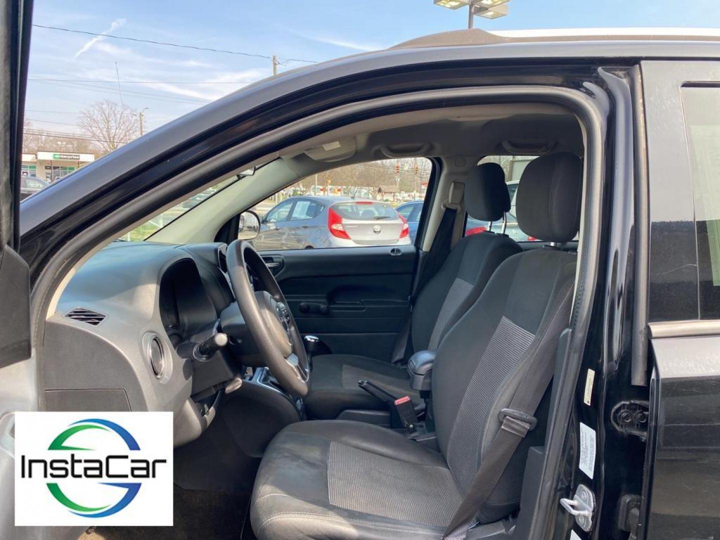 2014 Black Clearcoat /Dark Slate Gray Jeep Compass Sport FWD (1C4NJCBA9ED) with an 2.0L L4 DOHC 16V engine, 5-speed manual transmission, located at 6064 Gull Rd, Kalamazoo, MI, 49048, (269) 222-0088, 42.328388, -85.512924 - Introducing the impeccable 2014 Jeep Compass Sport, now available at our esteemed dealership. This used gem has been meticulously maintained and is ready to embark on its next adventure with you. With a remarkable mileage of 179,461 miles, this SUV has proven its reliability and longevity, making it - Photo#23