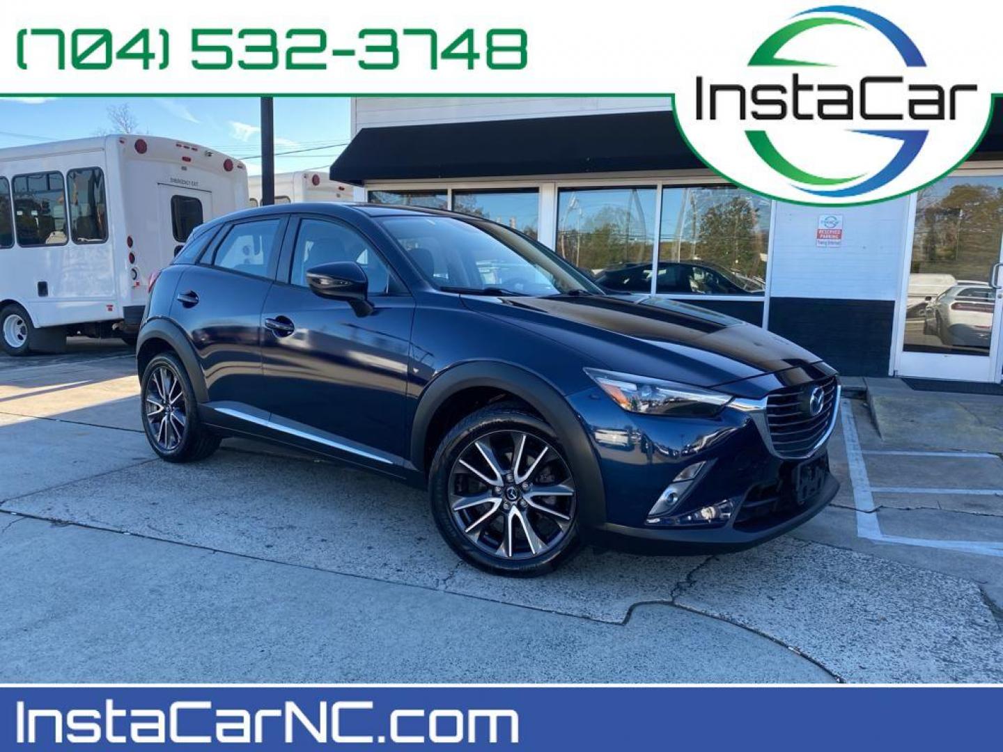 2017 Deep Crystal Blue Mica /Black Mazda CX-3 Grand Touring AWD (JM1DKFD77H0) with an 2.0L L4 DOHC 16V engine, 6A transmission, located at 6064 Gull Rd, Kalamazoo, MI, 49048, (269) 222-0088, 42.328388, -85.512924 - <b>Equipment</b><br>You'll never again be lost in a crowded city or a country region with the navigation system on this small suv. This unit has satellite radio capabilities. Engulf yourself with the crystal clear sound of a BOSE sound system in the vehicle. Bluetooth technology is built into this - Photo#0