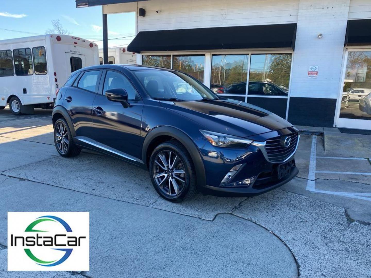 2017 Deep Crystal Blue Mica /Black Mazda CX-3 Grand Touring AWD (JM1DKFD77H0) with an 2.0L L4 DOHC 16V engine, 6A transmission, located at 6064 Gull Rd, Kalamazoo, MI, 49048, (269) 222-0088, 42.328388, -85.512924 - <b>Equipment</b><br>You'll never again be lost in a crowded city or a country region with the navigation system on this small suv. This unit has satellite radio capabilities. Engulf yourself with the crystal clear sound of a BOSE sound system in the vehicle. Bluetooth technology is built into this - Photo#7