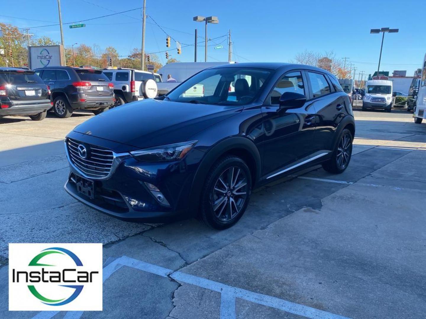 2017 Deep Crystal Blue Mica /Black Mazda CX-3 Grand Touring AWD (JM1DKFD77H0) with an 2.0L L4 DOHC 16V engine, 6A transmission, located at 6064 Gull Rd, Kalamazoo, MI, 49048, (269) 222-0088, 42.328388, -85.512924 - <b>Equipment</b><br>You'll never again be lost in a crowded city or a country region with the navigation system on this small suv. This unit has satellite radio capabilities. Engulf yourself with the crystal clear sound of a BOSE sound system in the vehicle. Bluetooth technology is built into this - Photo#9