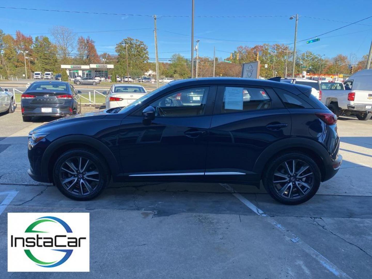 2017 Deep Crystal Blue Mica /Black Mazda CX-3 Grand Touring AWD (JM1DKFD77H0) with an 2.0L L4 DOHC 16V engine, 6A transmission, located at 6064 Gull Rd, Kalamazoo, MI, 49048, (269) 222-0088, 42.328388, -85.512924 - <b>Equipment</b><br>You'll never again be lost in a crowded city or a country region with the navigation system on this small suv. This unit has satellite radio capabilities. Engulf yourself with the crystal clear sound of a BOSE sound system in the vehicle. Bluetooth technology is built into this - Photo#10