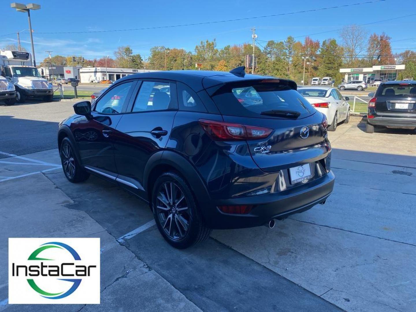 2017 Deep Crystal Blue Mica /Black Mazda CX-3 Grand Touring AWD (JM1DKFD77H0) with an 2.0L L4 DOHC 16V engine, 6A transmission, located at 6064 Gull Rd, Kalamazoo, MI, 49048, (269) 222-0088, 42.328388, -85.512924 - <b>Equipment</b><br>You'll never again be lost in a crowded city or a country region with the navigation system on this small suv. This unit has satellite radio capabilities. Engulf yourself with the crystal clear sound of a BOSE sound system in the vehicle. Bluetooth technology is built into this - Photo#11