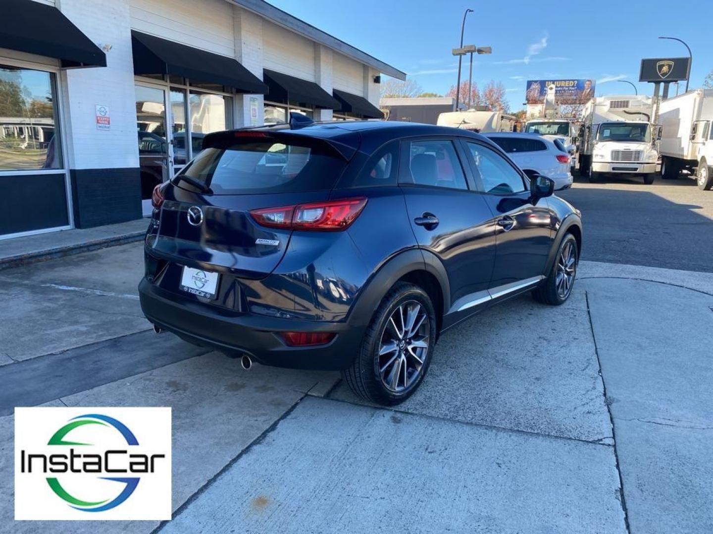 2017 Deep Crystal Blue Mica /Black Mazda CX-3 Grand Touring AWD (JM1DKFD77H0) with an 2.0L L4 DOHC 16V engine, 6A transmission, located at 6064 Gull Rd, Kalamazoo, MI, 49048, (269) 222-0088, 42.328388, -85.512924 - <b>Equipment</b><br>You'll never again be lost in a crowded city or a country region with the navigation system on this small suv. This unit has satellite radio capabilities. Engulf yourself with the crystal clear sound of a BOSE sound system in the vehicle. Bluetooth technology is built into this - Photo#13