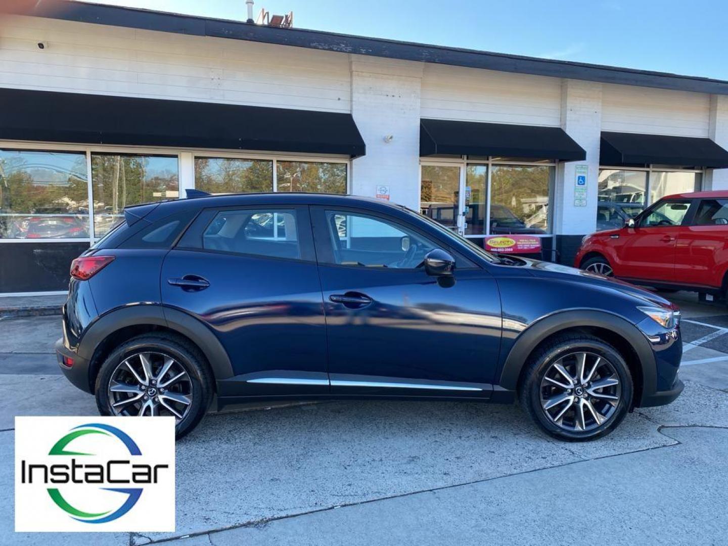 2017 Deep Crystal Blue Mica /Black Mazda CX-3 Grand Touring AWD (JM1DKFD77H0) with an 2.0L L4 DOHC 16V engine, 6A transmission, located at 6064 Gull Rd, Kalamazoo, MI, 49048, (269) 222-0088, 42.328388, -85.512924 - <b>Equipment</b><br>You'll never again be lost in a crowded city or a country region with the navigation system on this small suv. This unit has satellite radio capabilities. Engulf yourself with the crystal clear sound of a BOSE sound system in the vehicle. Bluetooth technology is built into this - Photo#14