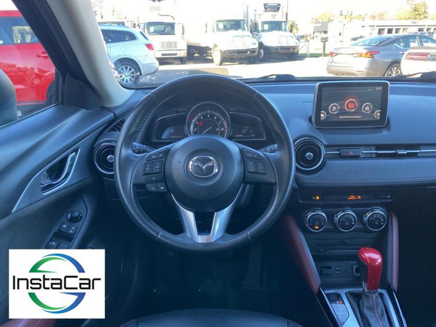 2017 Deep Crystal Blue Mica /Black Mazda CX-3 Grand Touring AWD (JM1DKFD77H0) with an 2.0L L4 DOHC 16V engine, 6A transmission, located at 6064 Gull Rd, Kalamazoo, MI, 49048, (269) 222-0088, 42.328388, -85.512924 - <b>Equipment</b><br>You'll never again be lost in a crowded city or a country region with the navigation system on this small suv. This unit has satellite radio capabilities. Engulf yourself with the crystal clear sound of a BOSE sound system in the vehicle. Bluetooth technology is built into this - Photo#29