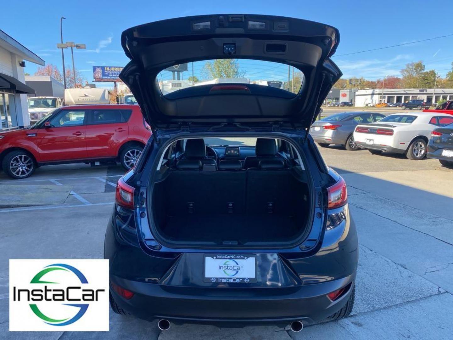 2017 Deep Crystal Blue Mica /Black Mazda CX-3 Grand Touring AWD (JM1DKFD77H0) with an 2.0L L4 DOHC 16V engine, 6A transmission, located at 6064 Gull Rd, Kalamazoo, MI, 49048, (269) 222-0088, 42.328388, -85.512924 - <b>Equipment</b><br>You'll never again be lost in a crowded city or a country region with the navigation system on this small suv. This unit has satellite radio capabilities. Engulf yourself with the crystal clear sound of a BOSE sound system in the vehicle. Bluetooth technology is built into this - Photo#32