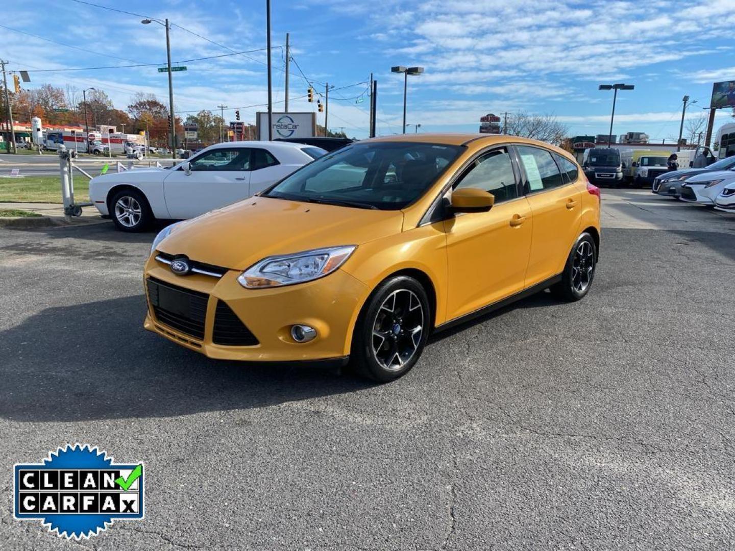 2012 Yellow Blaze Metallic Tri-coat /Charcoal Black w/Metal Gray Surround Ford Focus SE (1FAHP3K27CL) with an 2.0L L4 DOHC 16V engine, 6-speed auto-shift manual transmission, located at 6064 Gull Rd, Kalamazoo, MI, 49048, (269) 222-0088, 42.328388, -85.512924 - For sale at our dealership is a well-maintained 2012 Ford Focus SE, perfect for those seeking a reliable and efficient vehicle. This compact sedan is equipped with a fuel-efficient 4-cylinder, 2.0L engine, providing a smooth and responsive driving experience. With front-wheel drive, the Focus SE off - Photo#8