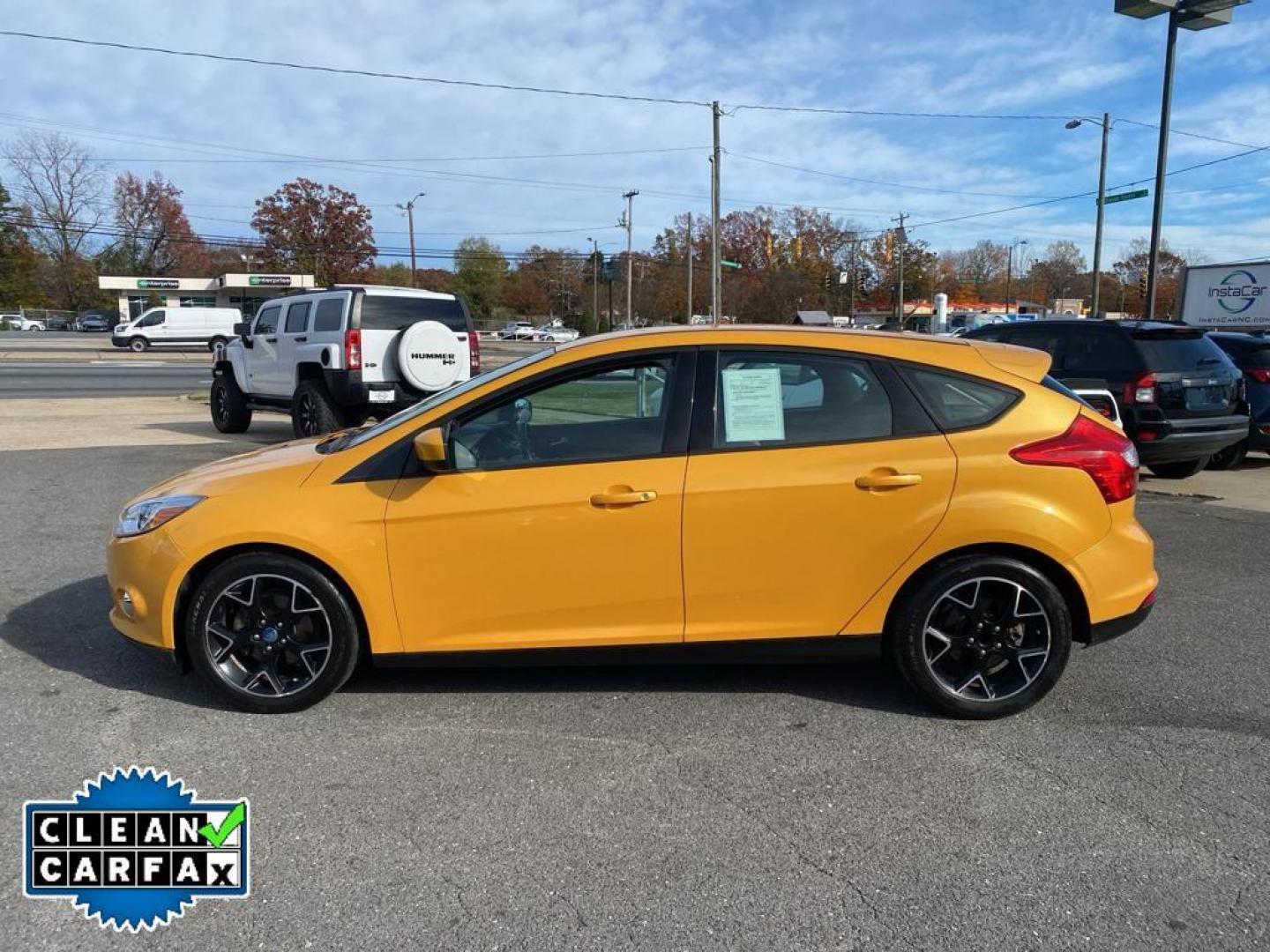 2012 Yellow Blaze Metallic Tri-coat /Charcoal Black w/Metal Gray Surround Ford Focus SE (1FAHP3K27CL) with an 2.0L L4 DOHC 16V engine, 6-speed auto-shift manual transmission, located at 6064 Gull Rd, Kalamazoo, MI, 49048, (269) 222-0088, 42.328388, -85.512924 - For sale at our dealership is a well-maintained 2012 Ford Focus SE, perfect for those seeking a reliable and efficient vehicle. This compact sedan is equipped with a fuel-efficient 4-cylinder, 2.0L engine, providing a smooth and responsive driving experience. With front-wheel drive, the Focus SE off - Photo#9