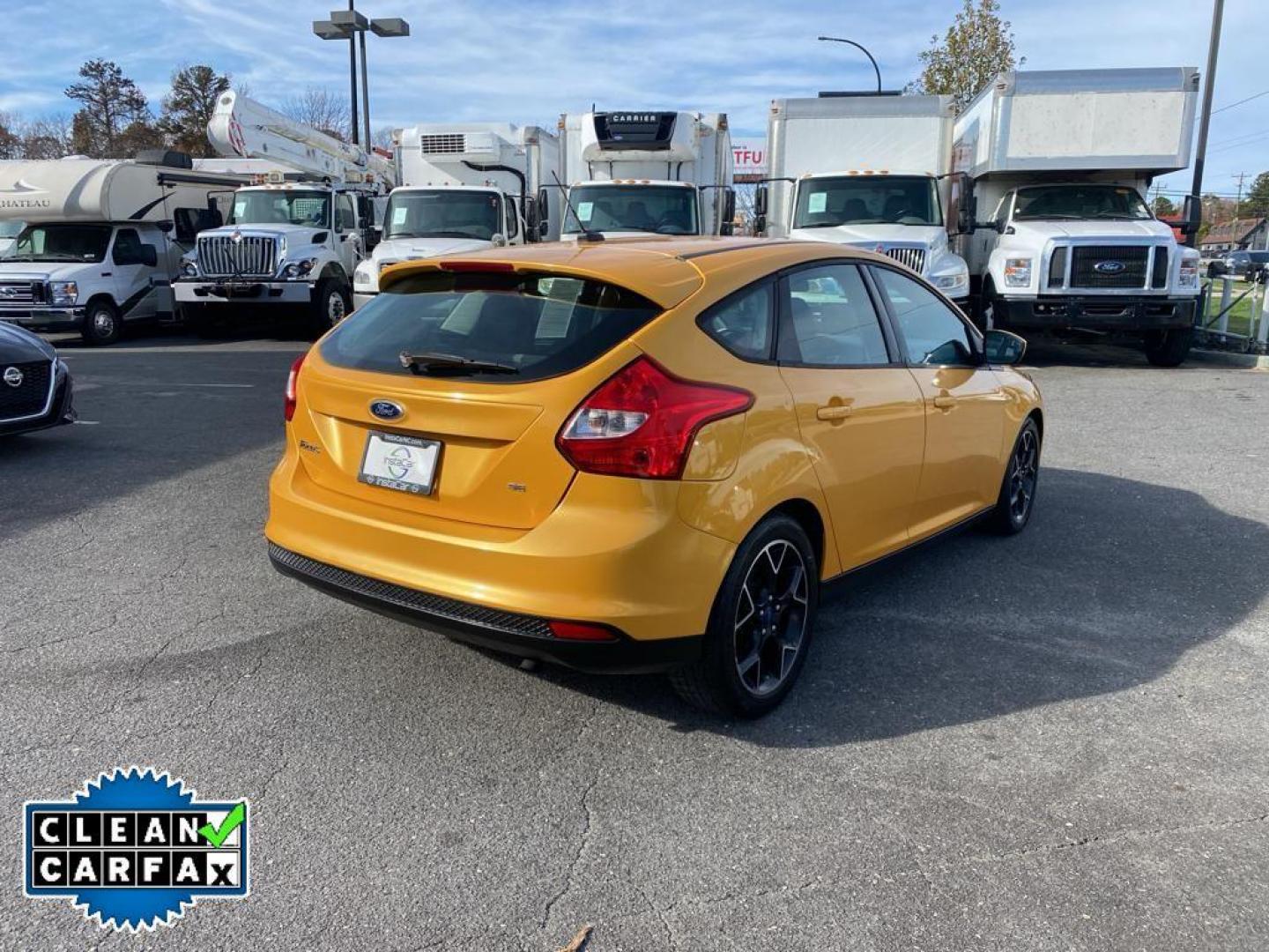 2012 Yellow Blaze Metallic Tri-coat /Charcoal Black w/Metal Gray Surround Ford Focus SE (1FAHP3K27CL) with an 2.0L L4 DOHC 16V engine, 6-speed auto-shift manual transmission, located at 6064 Gull Rd, Kalamazoo, MI, 49048, (269) 222-0088, 42.328388, -85.512924 - For sale at our dealership is a well-maintained 2012 Ford Focus SE, perfect for those seeking a reliable and efficient vehicle. This compact sedan is equipped with a fuel-efficient 4-cylinder, 2.0L engine, providing a smooth and responsive driving experience. With front-wheel drive, the Focus SE off - Photo#12