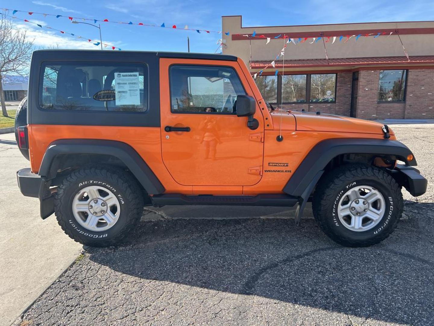 2012 orange Jeep Wrangler Sport 4WD (1C4AJWAG7CL) with an 3.6L V6 DOHC 24V FFV engine, Automatic transmission, located at 6064 Gull Rd, Kalamazoo, MI, 49048, (269) 222-0088, 42.328388, -85.512924 - Photo#4