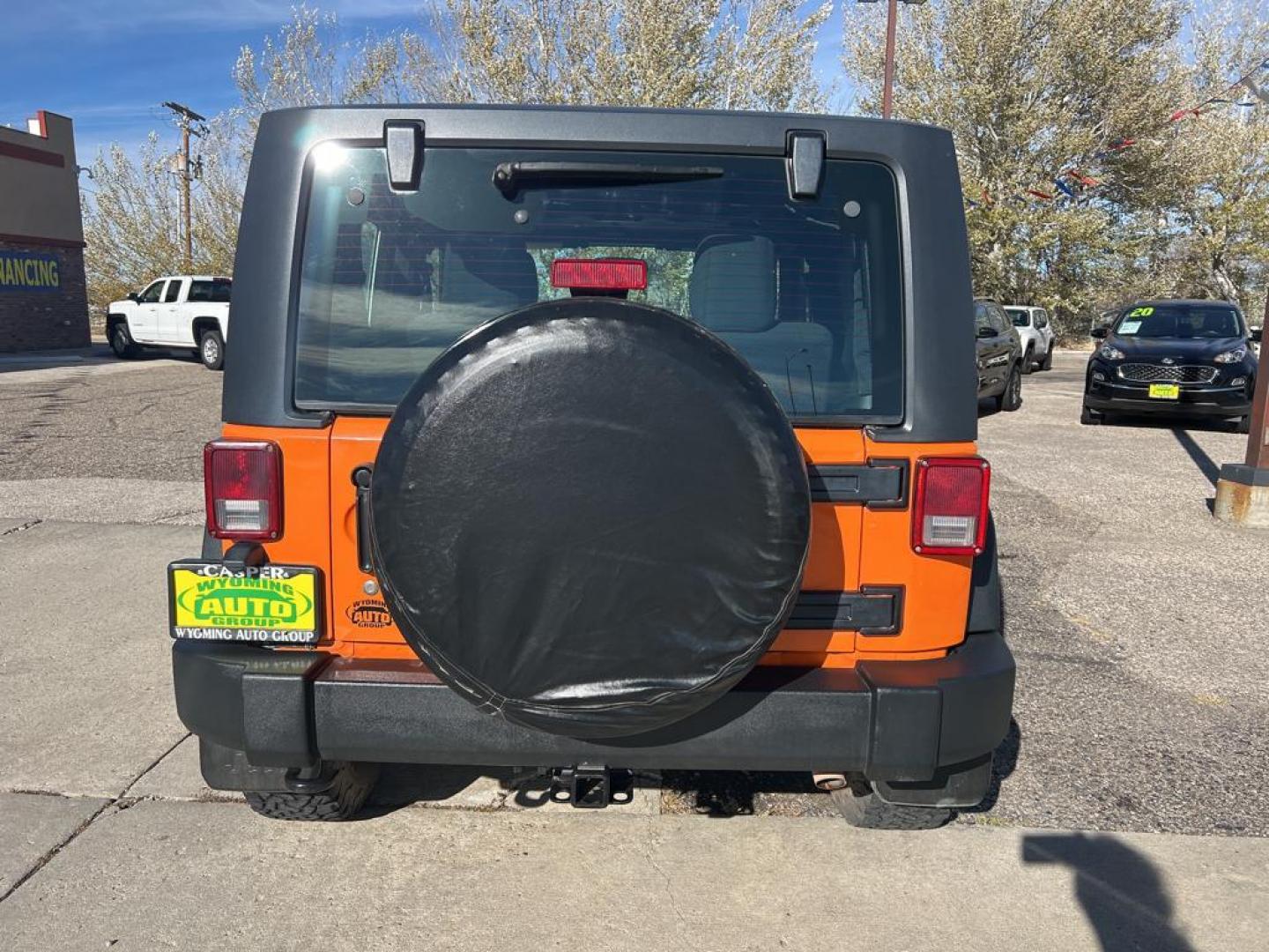 2012 orange Jeep Wrangler Sport 4WD (1C4AJWAG7CL) with an 3.6L V6 DOHC 24V FFV engine, Automatic transmission, located at 6064 Gull Rd, Kalamazoo, MI, 49048, (269) 222-0088, 42.328388, -85.512924 - Photo#5