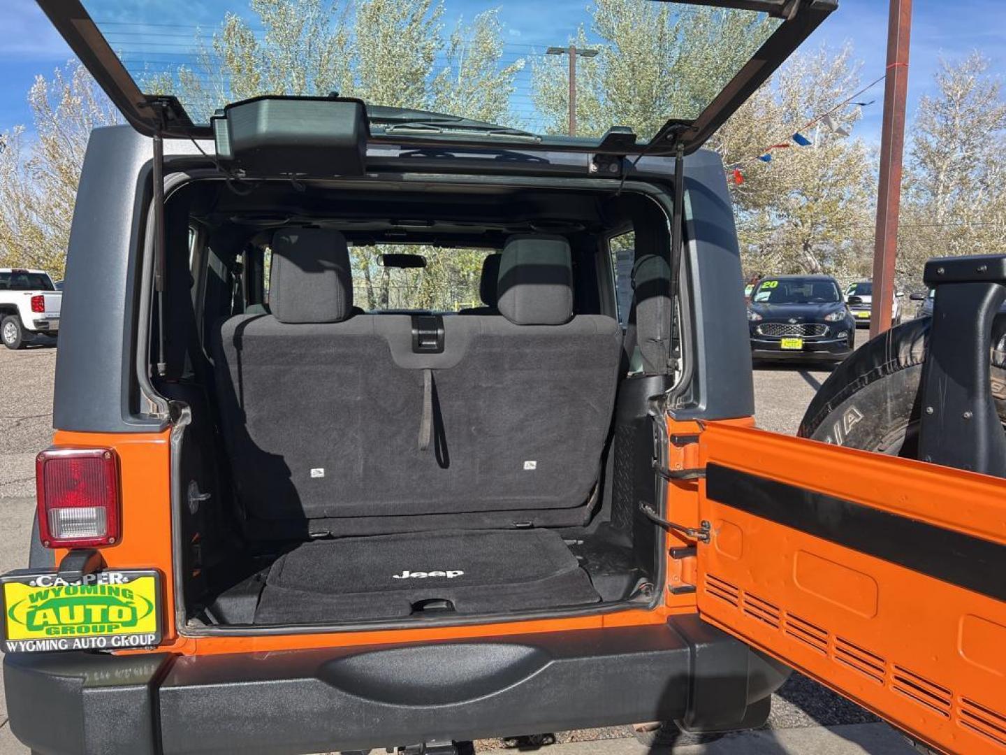 2012 orange Jeep Wrangler Sport 4WD (1C4AJWAG7CL) with an 3.6L V6 DOHC 24V FFV engine, Automatic transmission, located at 6064 Gull Rd, Kalamazoo, MI, 49048, (269) 222-0088, 42.328388, -85.512924 - Photo#7