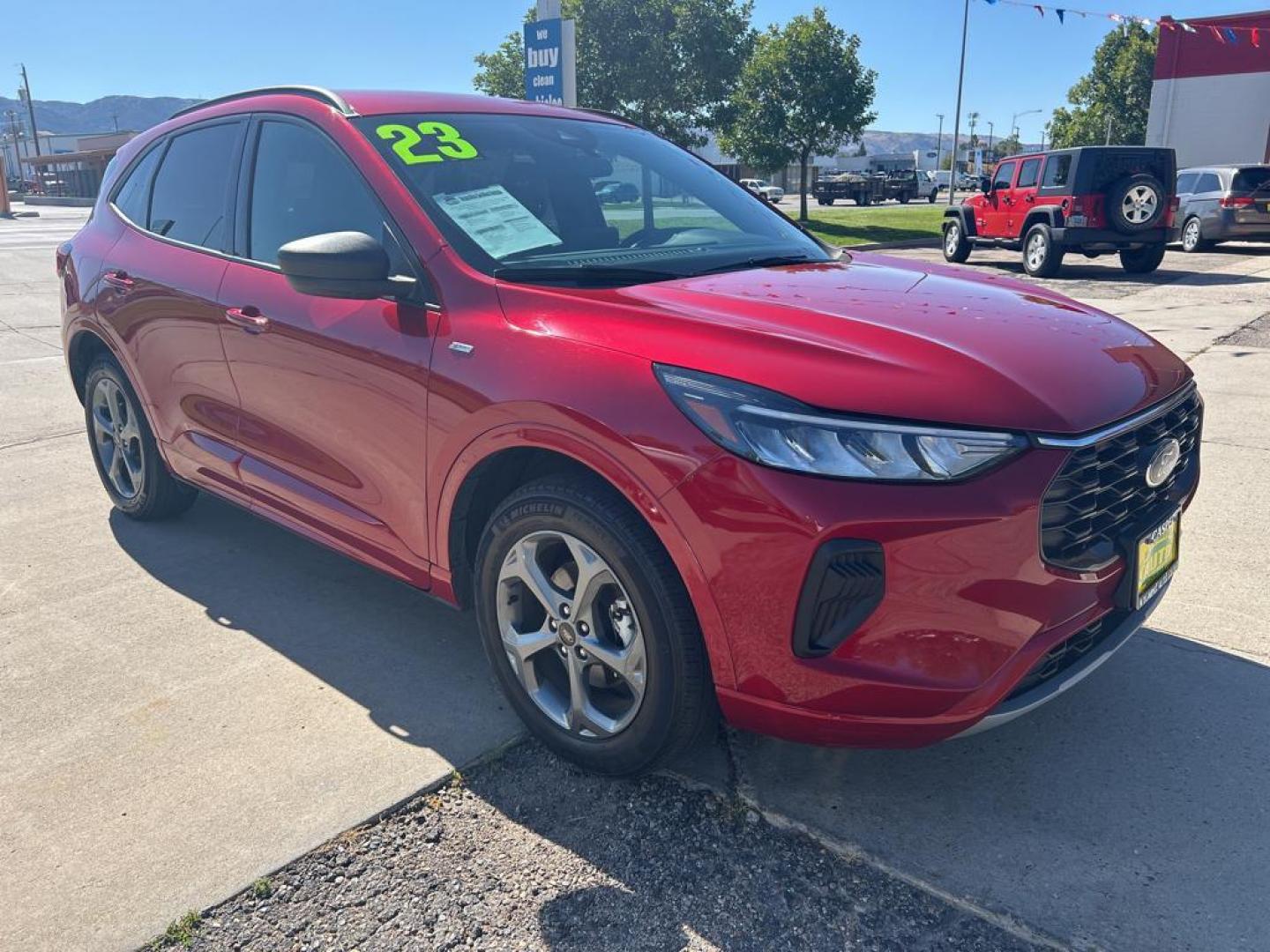 2023 maroon Ford Escape ST-Line AWD (1FMCU9MN3PU) with an 1.5L L3 engine, 8A transmission, located at 6064 Gull Rd, Kalamazoo, MI, 49048, (269) 222-0088, 42.328388, -85.512924 - Discover the exceptional value and performance of the 2023 Ford Escape ST Line, now available at our dealership. This sleek and stylish SUV, with only 33,682 miles, offers a perfect blend of comfort, technology, and capability for both city and off-road adventures. Its powerful yet efficient 3-cylin - Photo#3